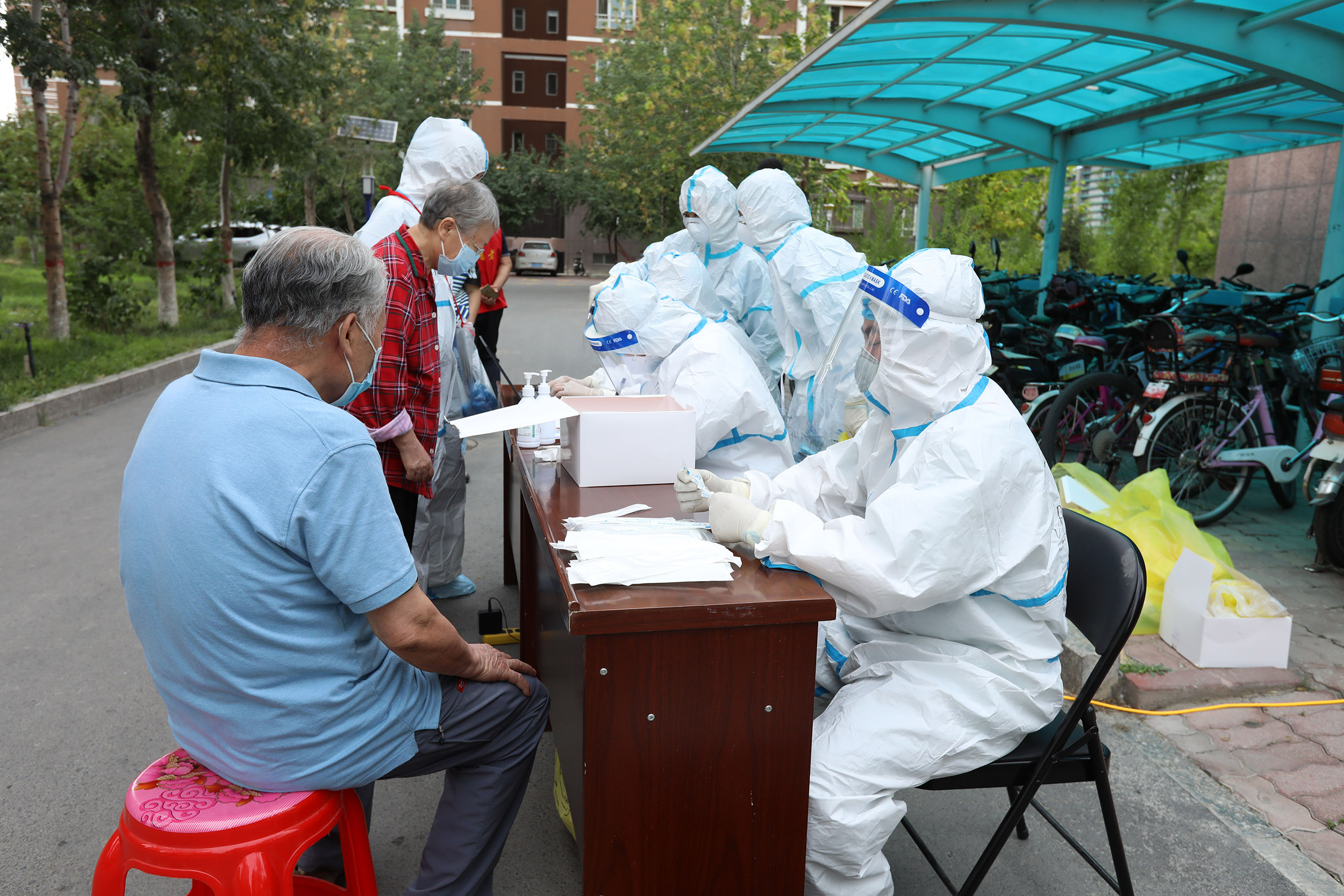 Residents undergo coronavirus testing in the Xinjiang province of China, on August 1. 