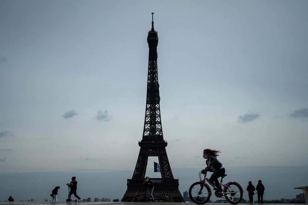 A child rides a bicycle on Trocadero Plaza in front of the Eiffel Tower in Paris on May 11.