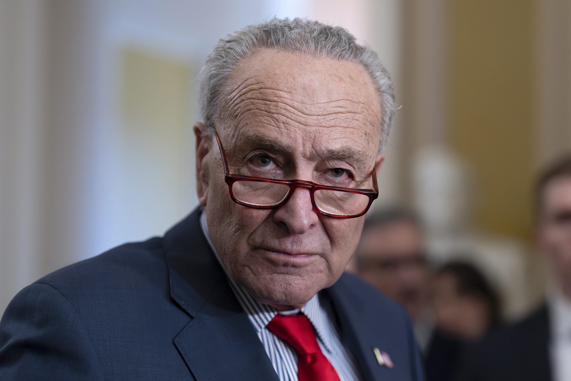 Senate Majority Leader Chuck Schumer speaks to reporters at the Capitol in Washington D.C, on March 12.