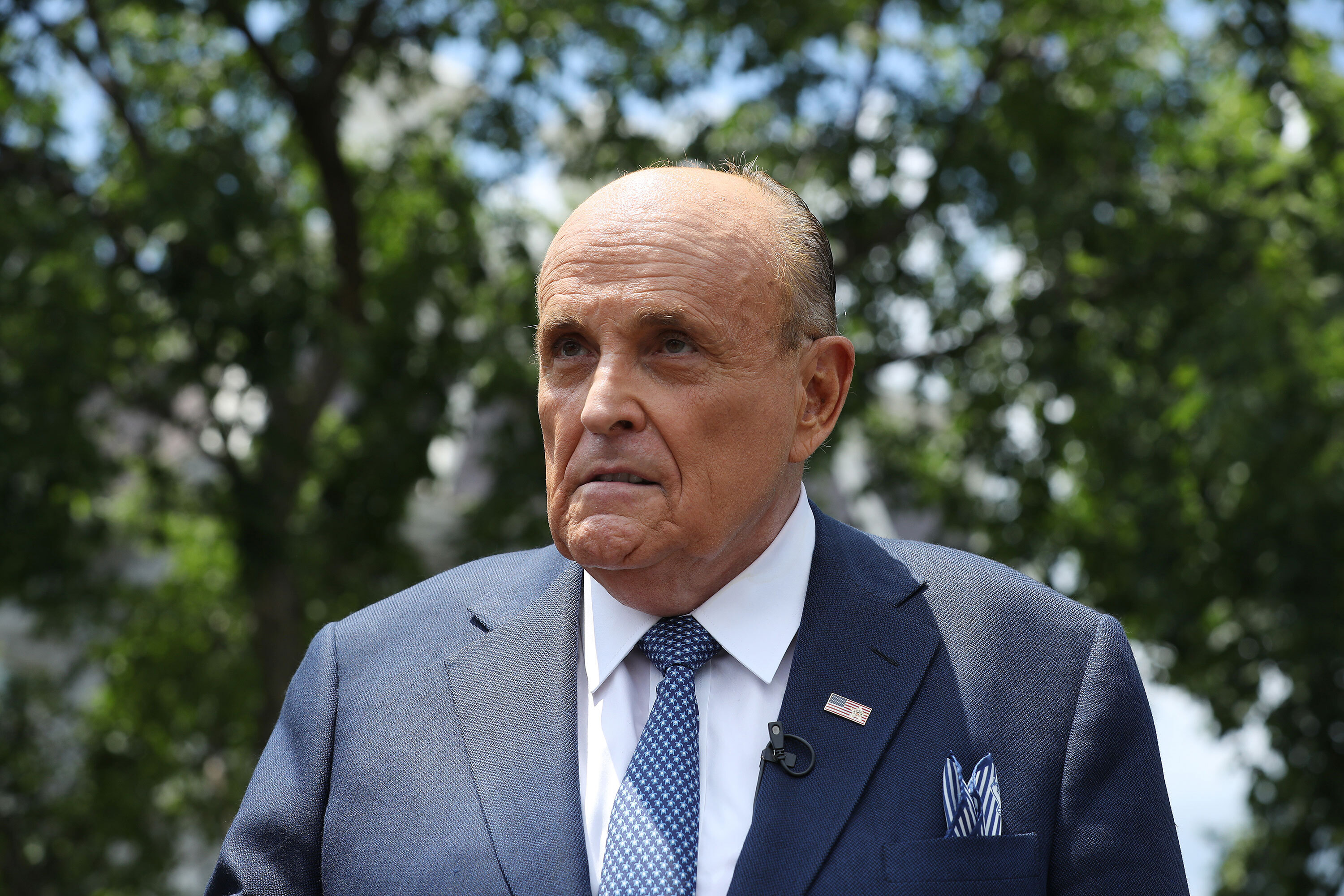 President Donald Trump's lawyer and former New York City mayor Rudy Giuliani talks to journalists outside the White House on July 1, in Washington, DC. 