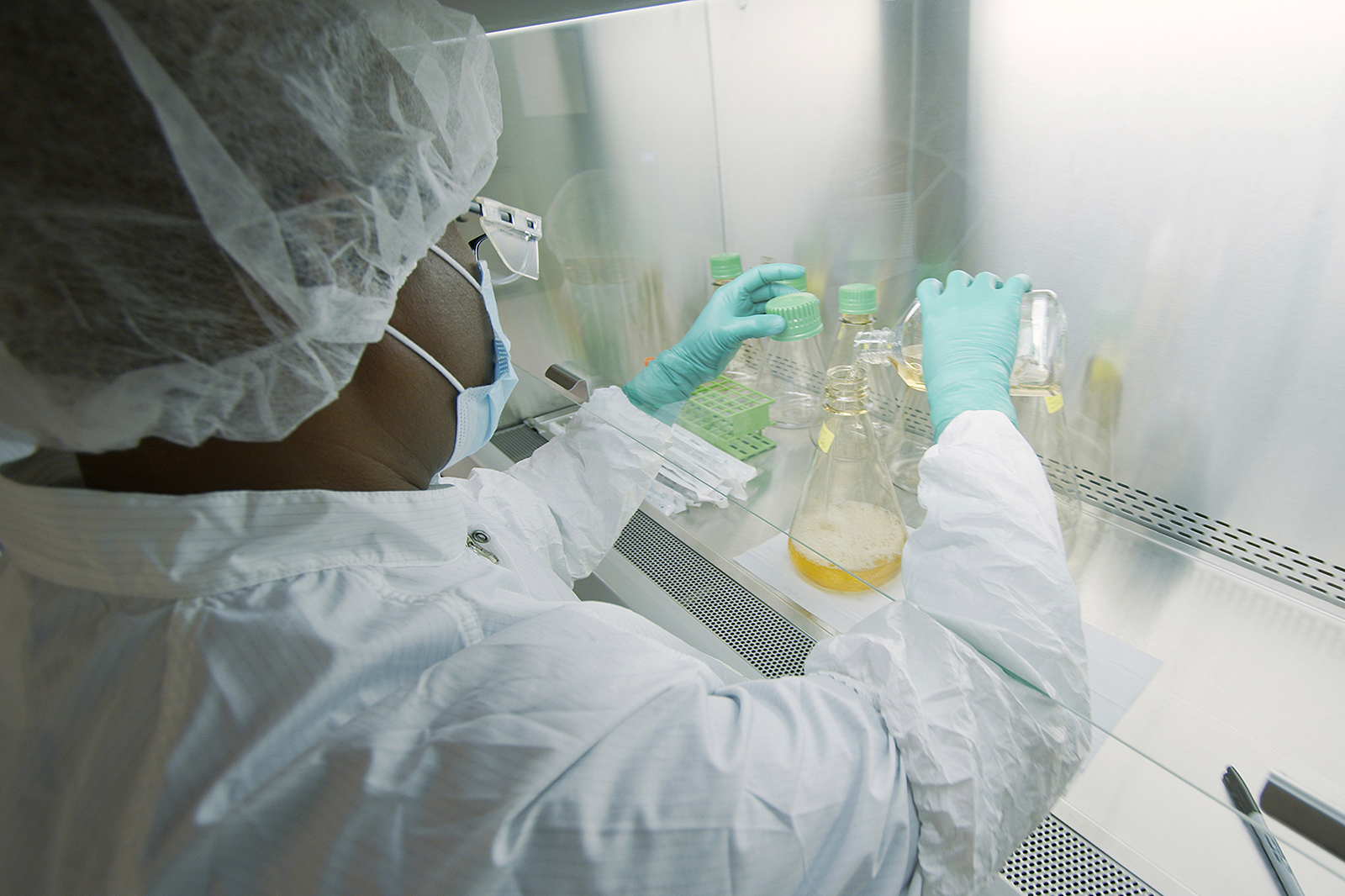 In this May 2020 photo provided by Eli Lilly, a researcher tests possible Covid-19 antibodies in a laboratory in Indianapolis.