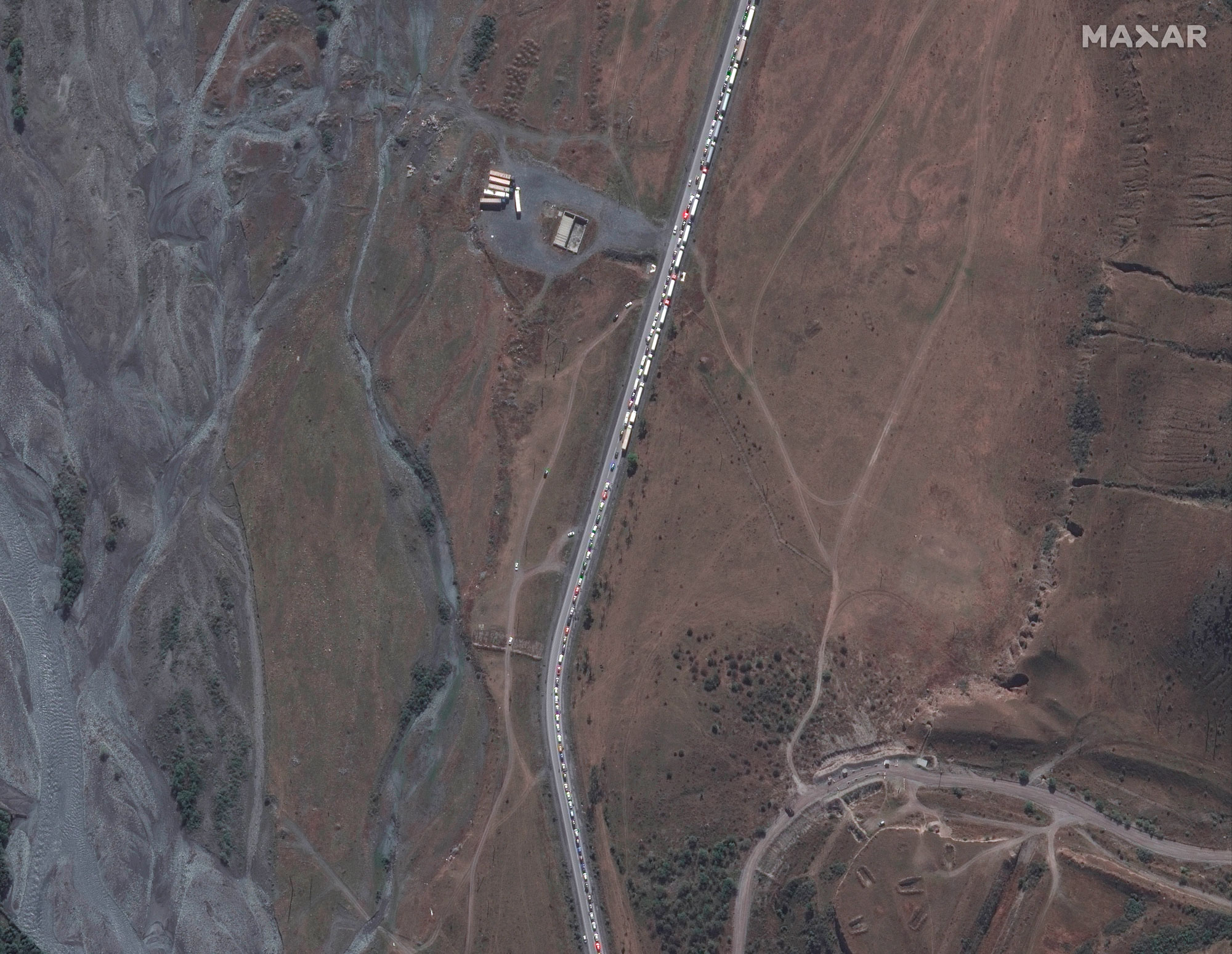 This satellite image provided by Maxar Technologies shows an overview of the traffic jam near the Russia border with Georgia on Sunday.