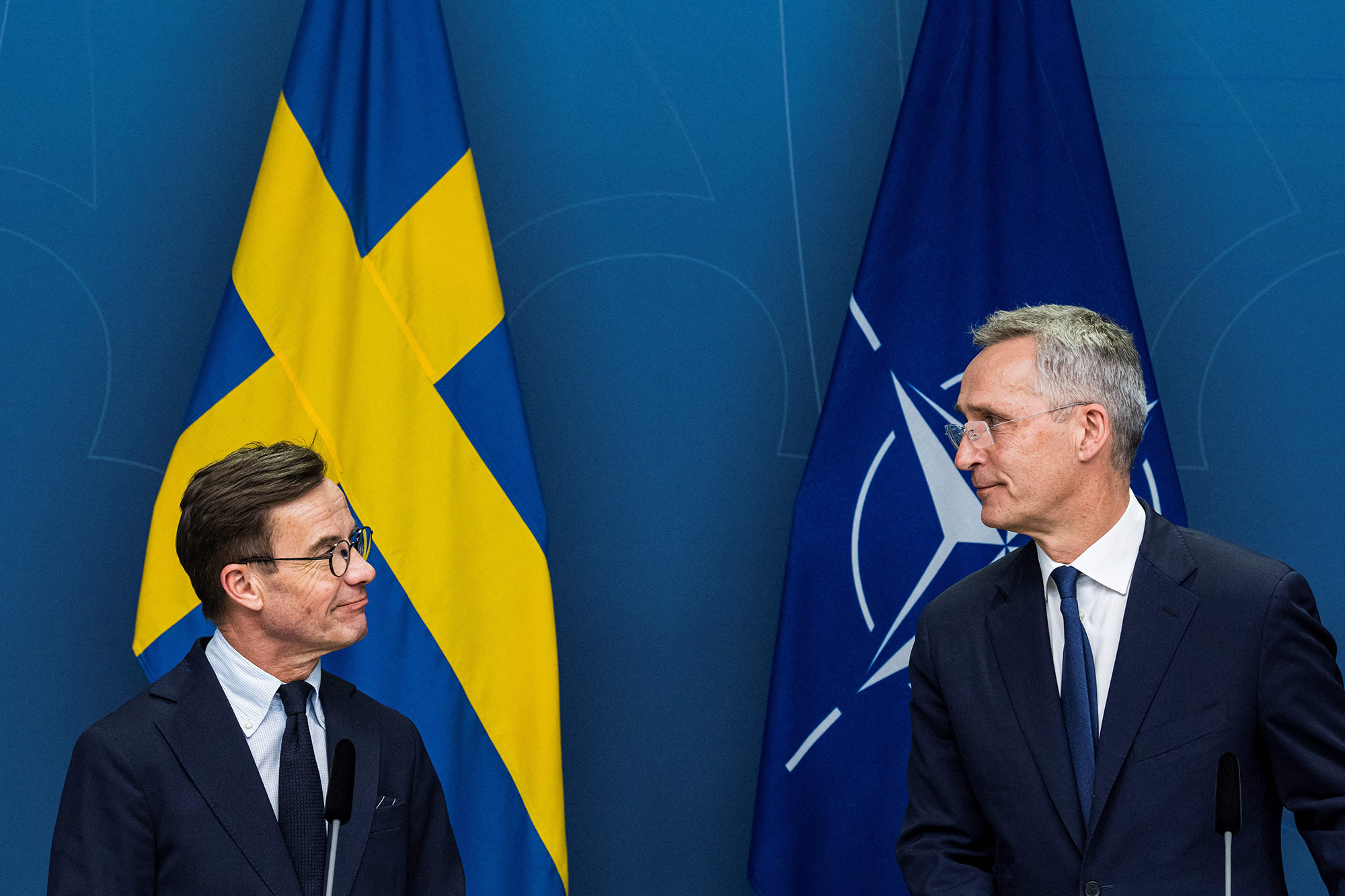 NATO Secretary General Jens Stoltenberg, right, and Swedish Prime Minister Ulf Kristersson look at each other as they address a joint press conference in Stockholm, Sweden, on March 7.