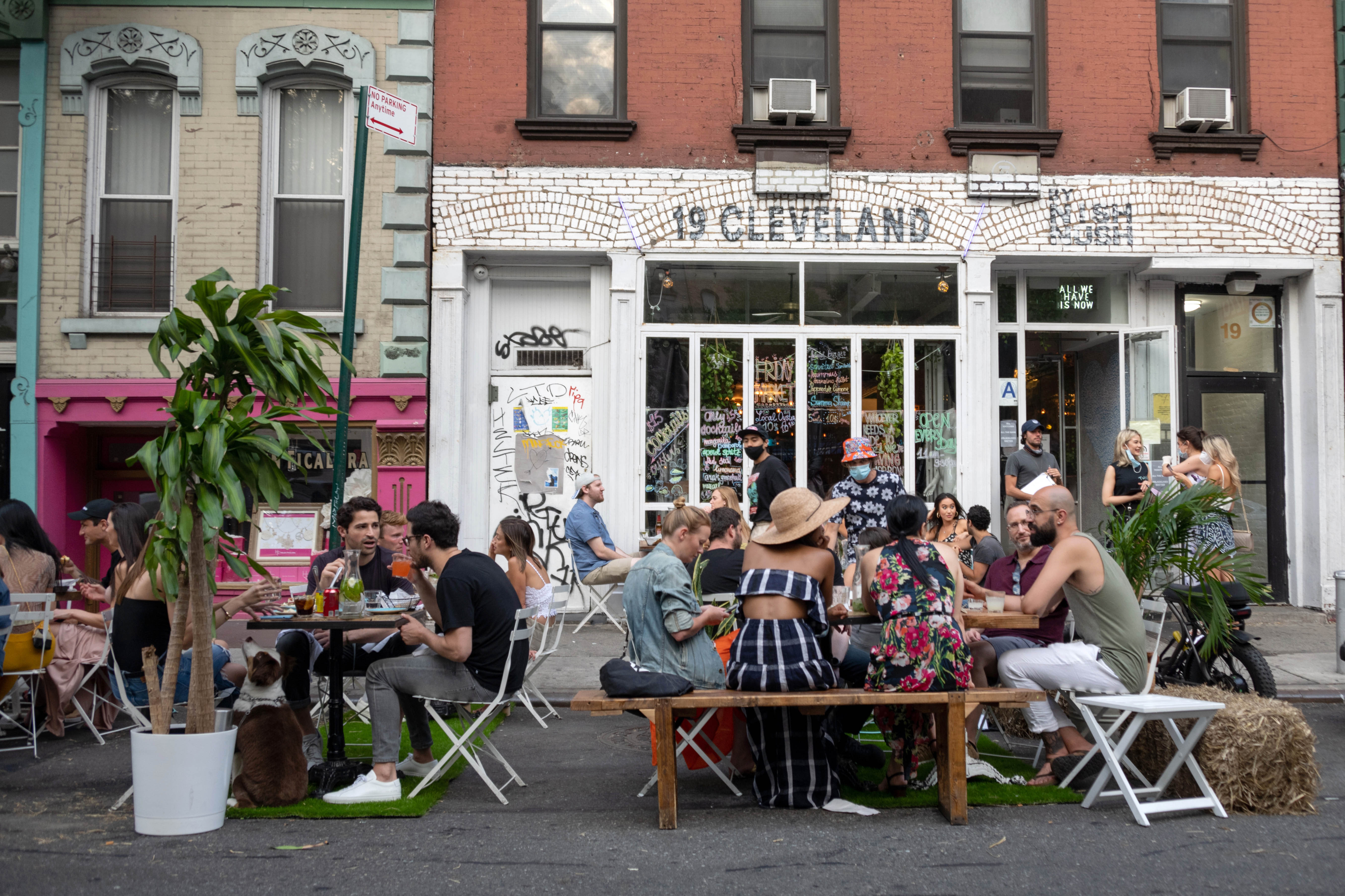 People in New York dine outside on June 26.