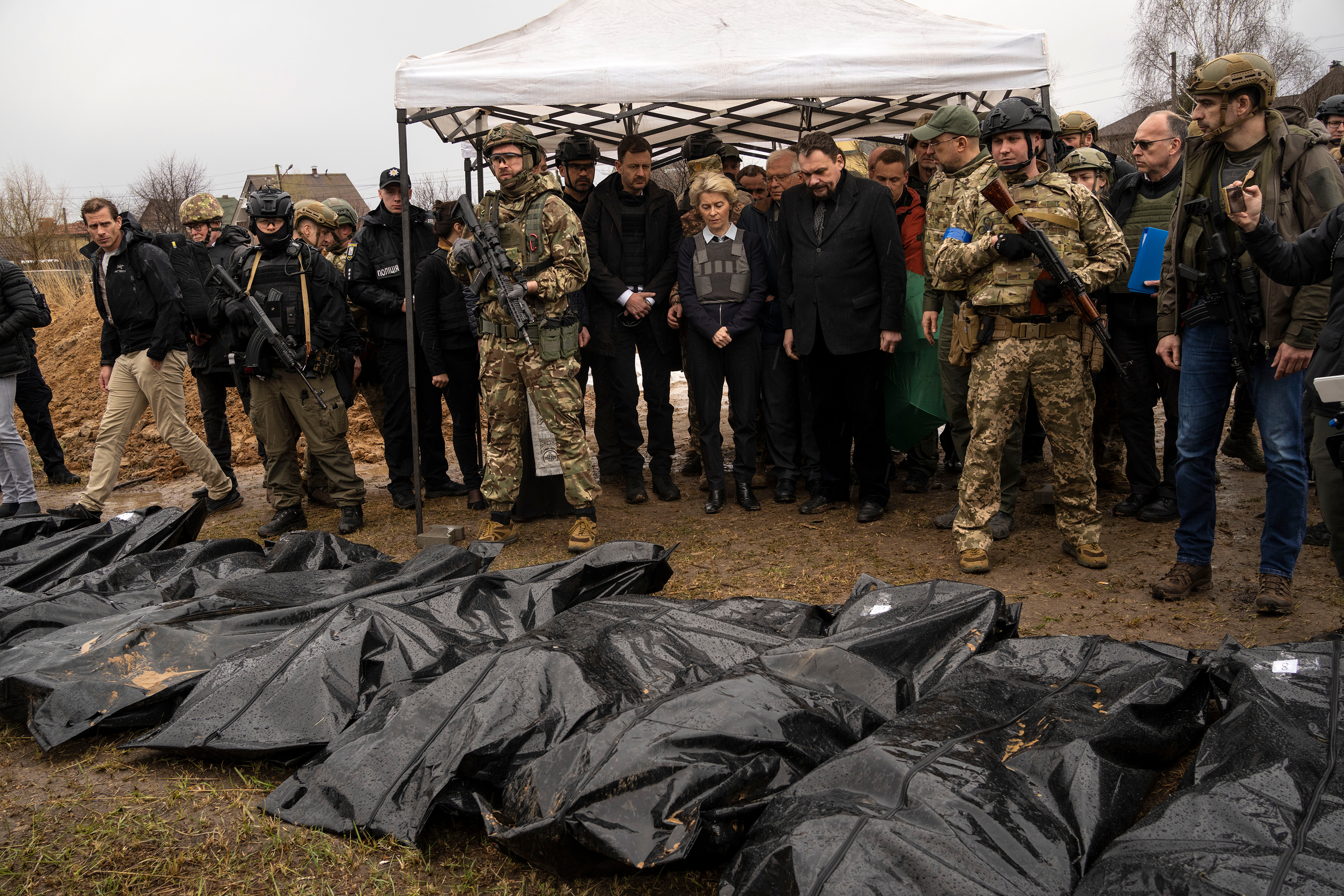 European Commission President Ursula von der Leyen looks at bodies that were pulled out of a mass grave in Bucha, Ukraine, on April 8.