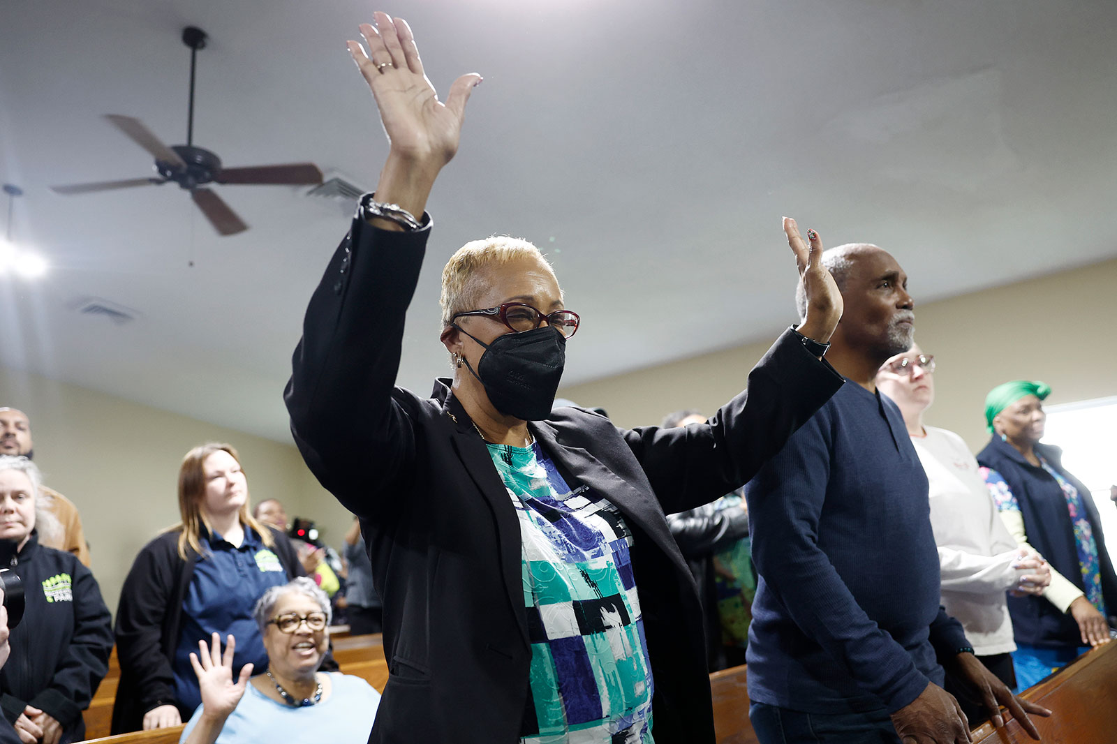 People pray during a vigil for victims of the ollapse at the Mount Olive Baptist Church on Tuesday, March 26.