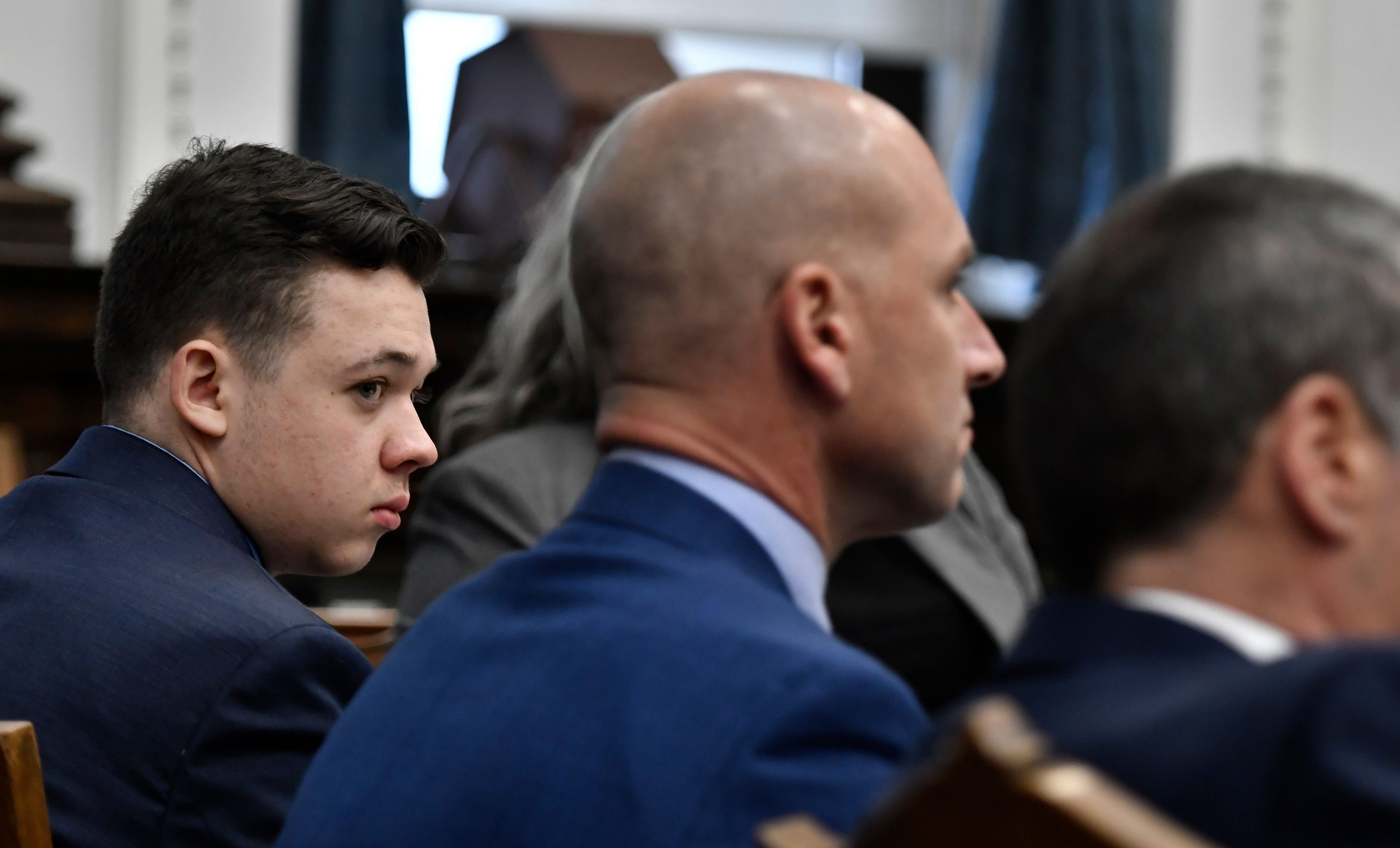 Kyle Rittenhouse listens as the attorneys and the judge talk about jury instructions in Kenosha, Wisconsin, on Monday.
