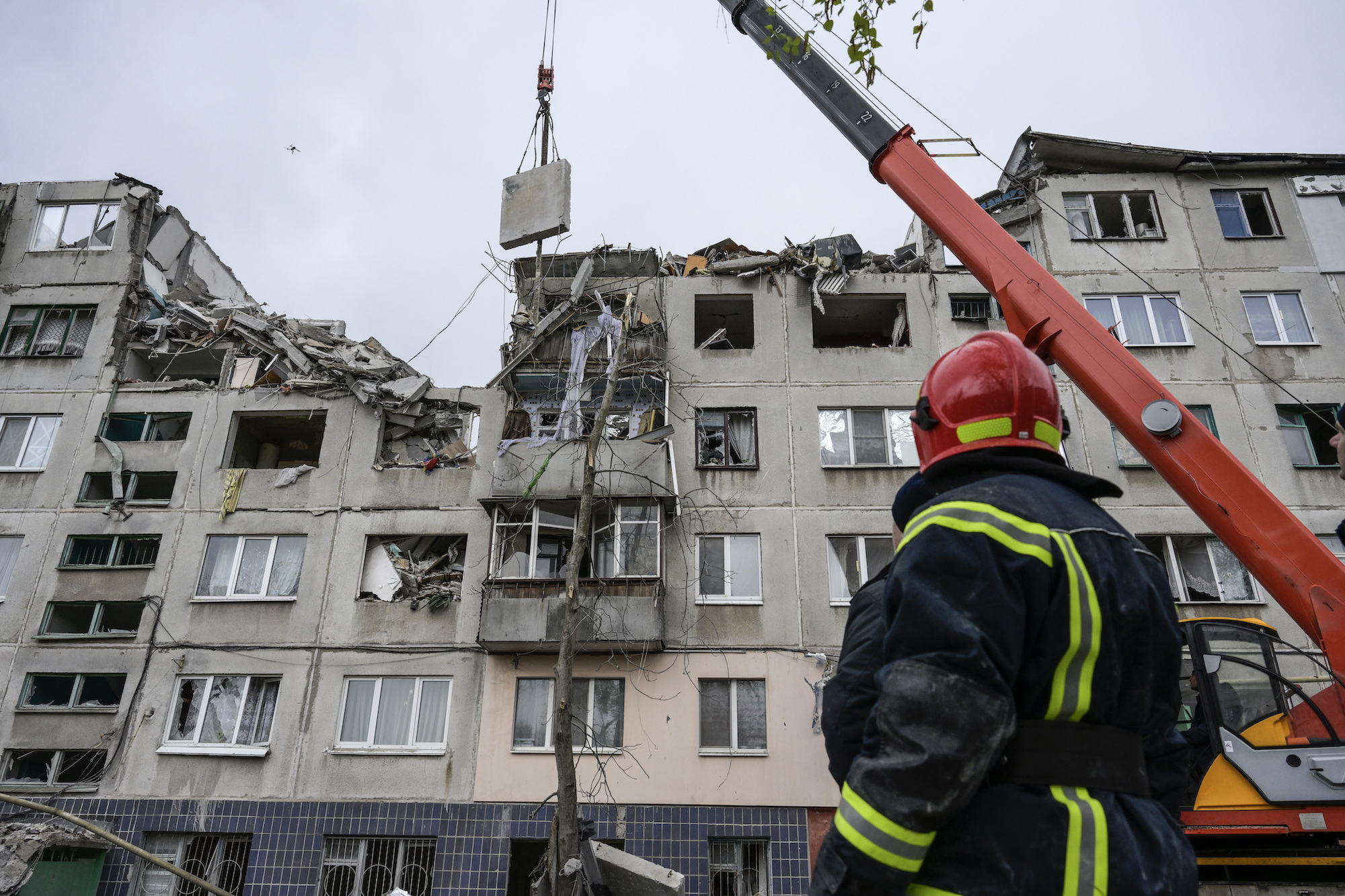 Emergency workers work after a missile strike in Sloviansk on Saturday.