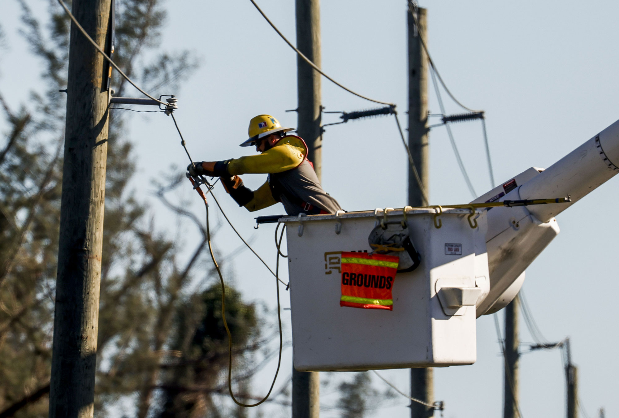 A lineman works to restore power in Ft. Myers, Florida, on September 30. 