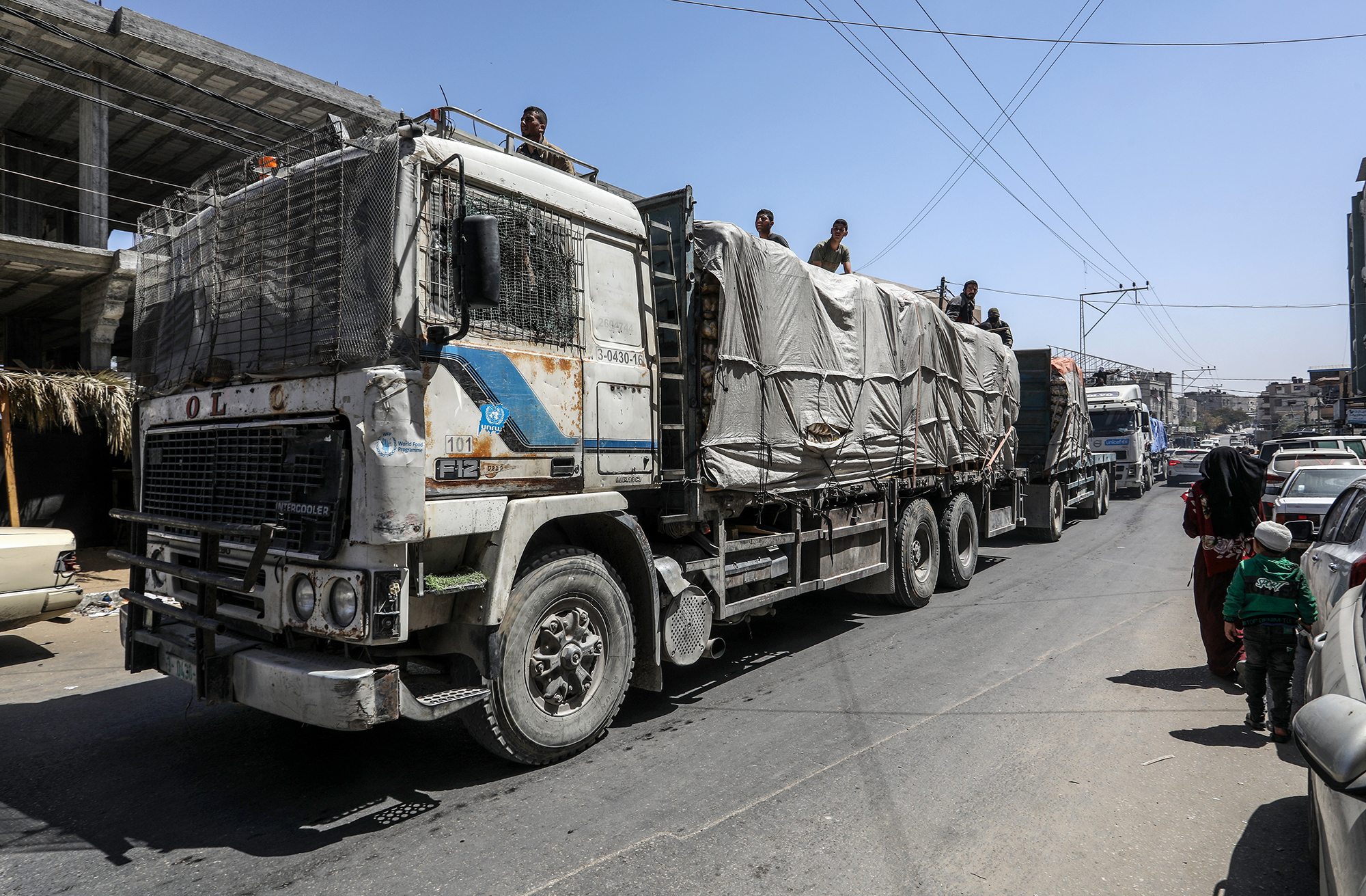 Trucks loaded with food head into Rafah, Gaza, on April 3. 