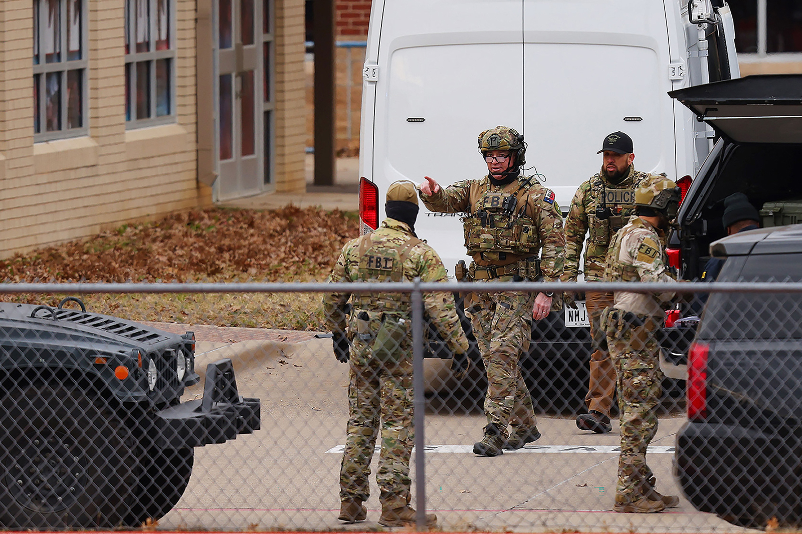 SWAT team members deploy near the Congregation Beth Israel Synagogue in Colleyville, Texas, some 25 miles (40 kilometers) west of Dallas, on January 15.