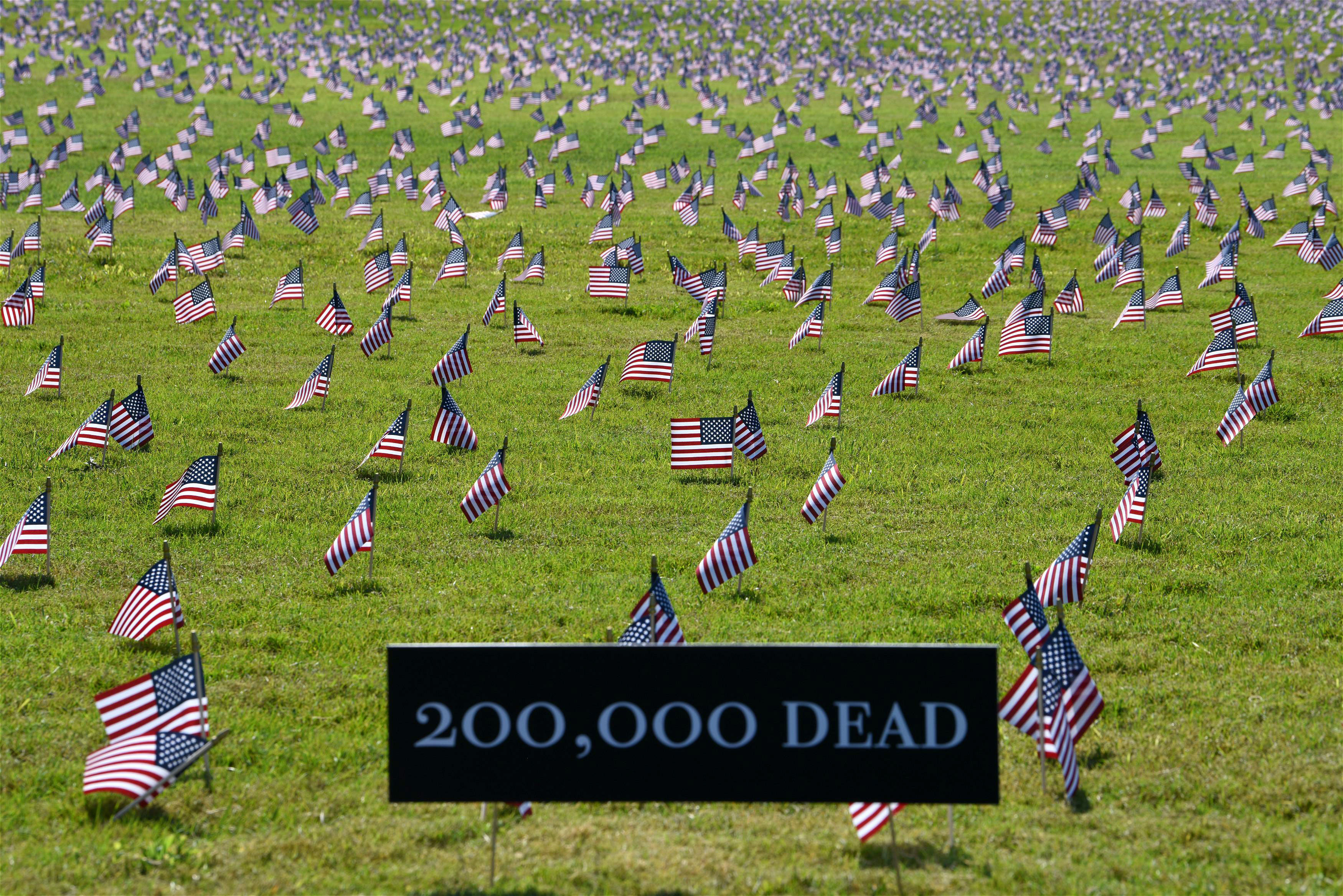 American flags are placed on the National Mall in Washington, DC, on September 22, in memory of the more than 200,000 people who have died from Covid-19 nationwide.