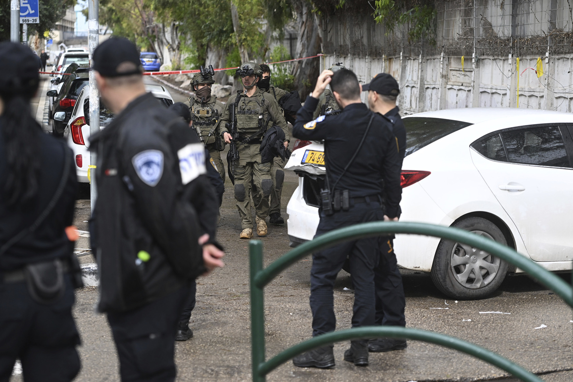 Israeli police examine the site of a car-ramming attack in Haifa, Israel, on January 29.