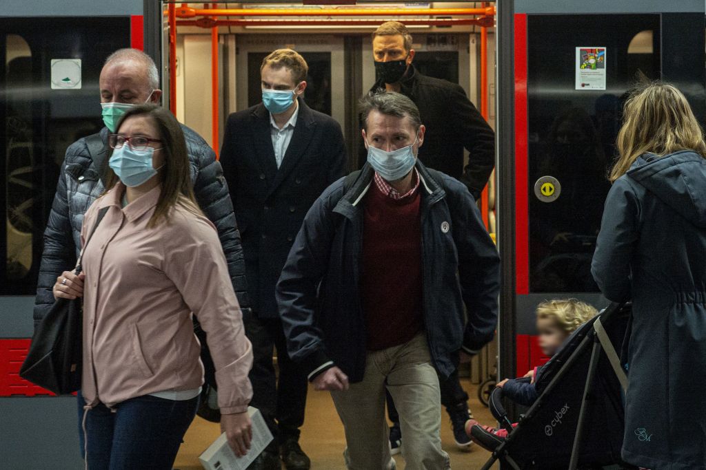 Commuters in Prague wear masks in a metro station on Tuesday, after new restrictions in the Czech Republic came into force.