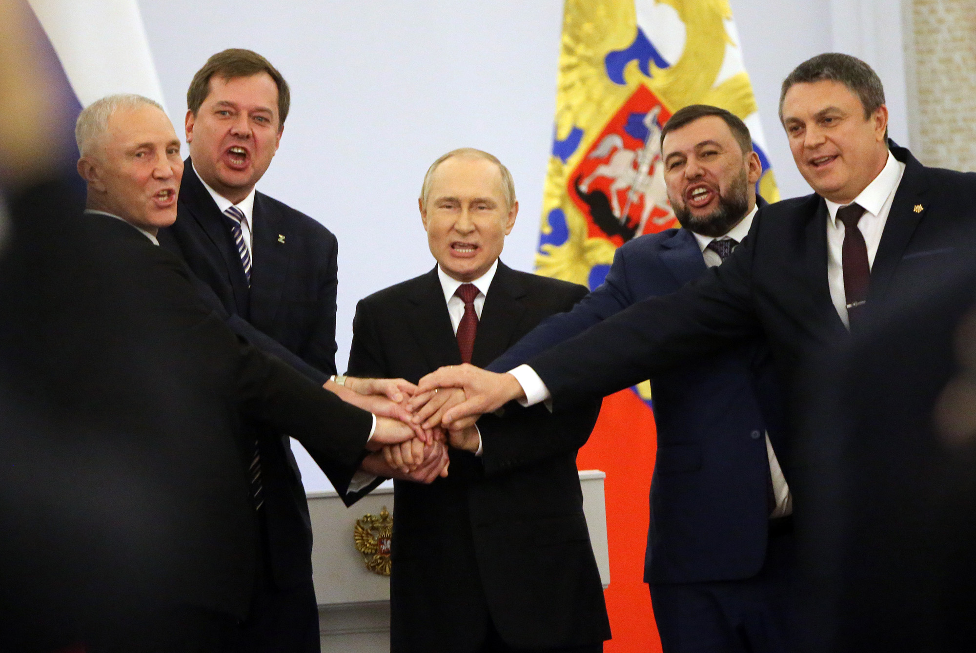 Russian President Vladimir Putin, center, with Ukrainian separatist regional leaders; Vladimir Saldo, the Russian appointed head of Kherson, left, Yevgeniy Balitsky, second left, Leonid Pasechnik, right, and Denis Pushilin, second right, seen during the annexation ceremony of four Ukrainian regions at the Grand Kremlin Palace, September 30, in Moscow, Russia.