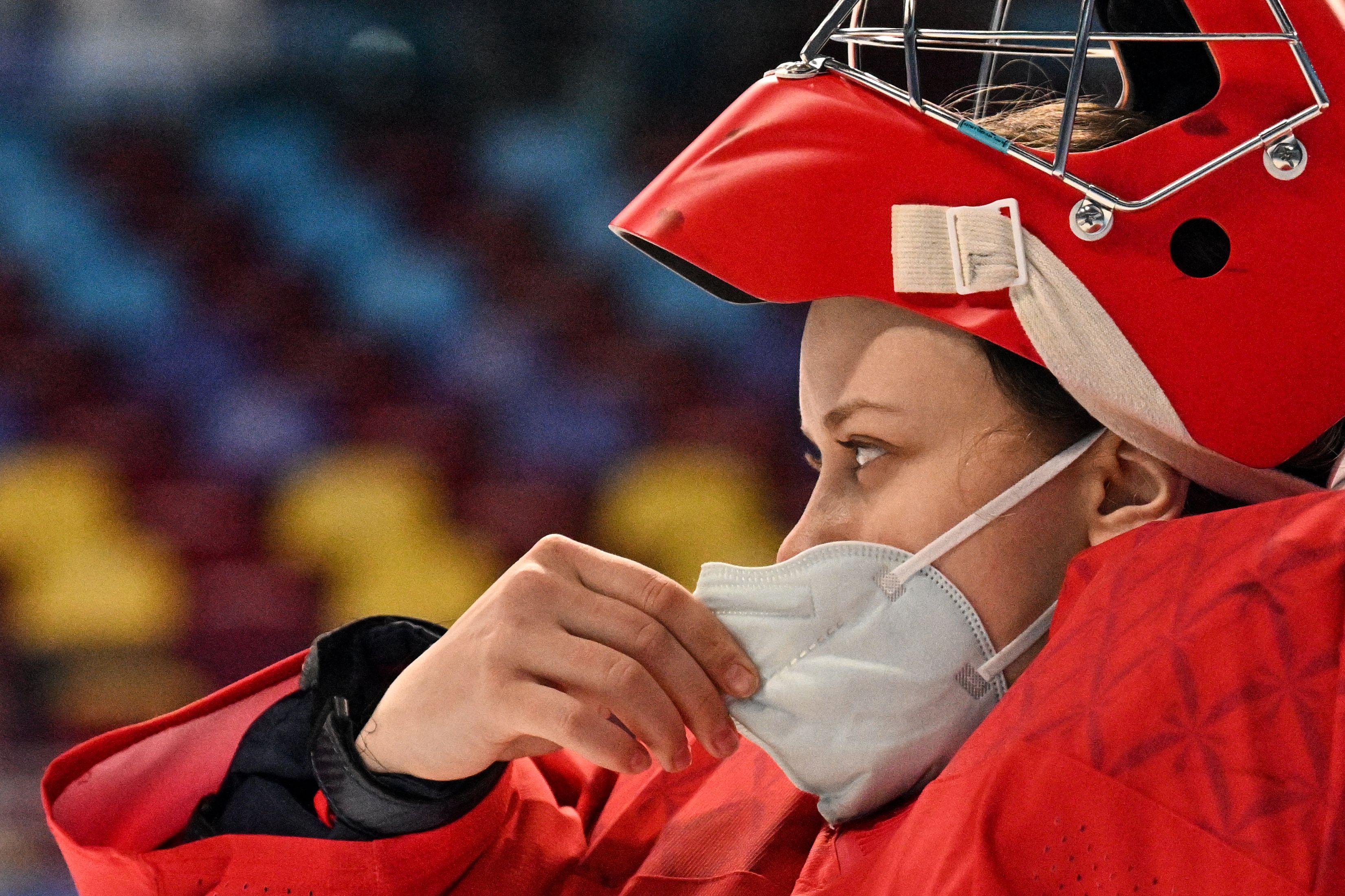 Russian Olympic Committee's goaltender Mariia Sorokina checks her face mask during a women's group A match at the Beijing 2022 Winter Games at the Wukesong Sports Centre on February 7.