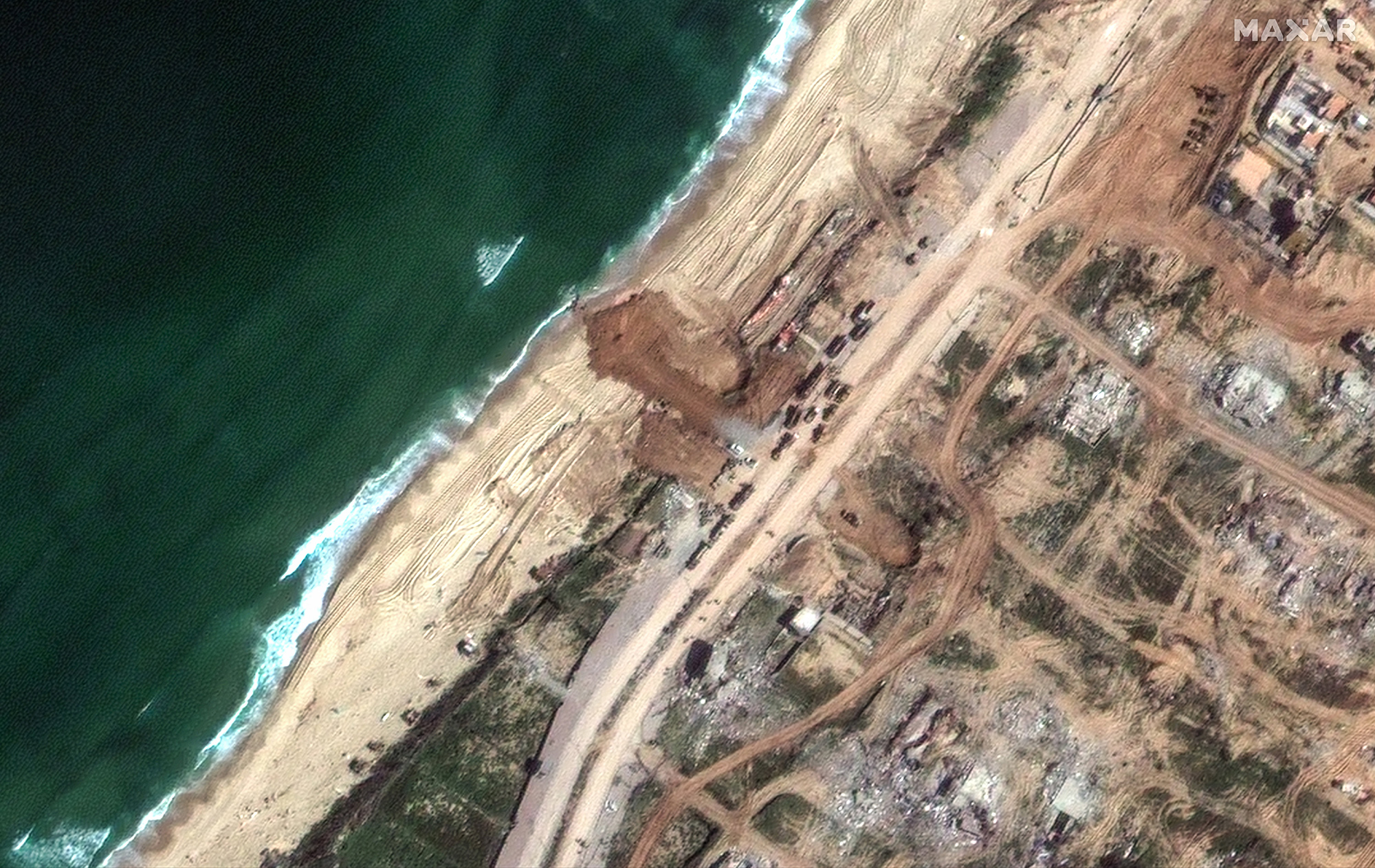 Satellite images taken on March 11 show site of jetty where aid ship set to dock in Gaza.