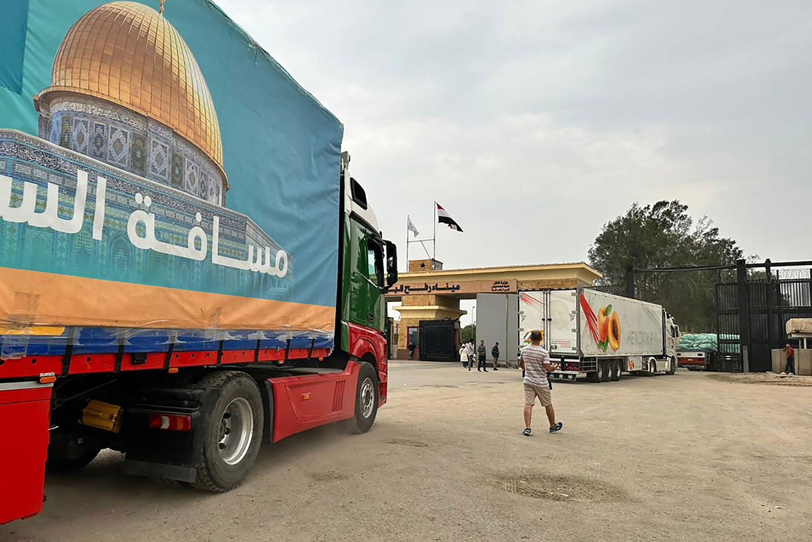 Trucks carrying aid are seen on the Egyptian side of the Rafah border crossing, waiting to cross into southern Gaza on Wednesday, December 6.
