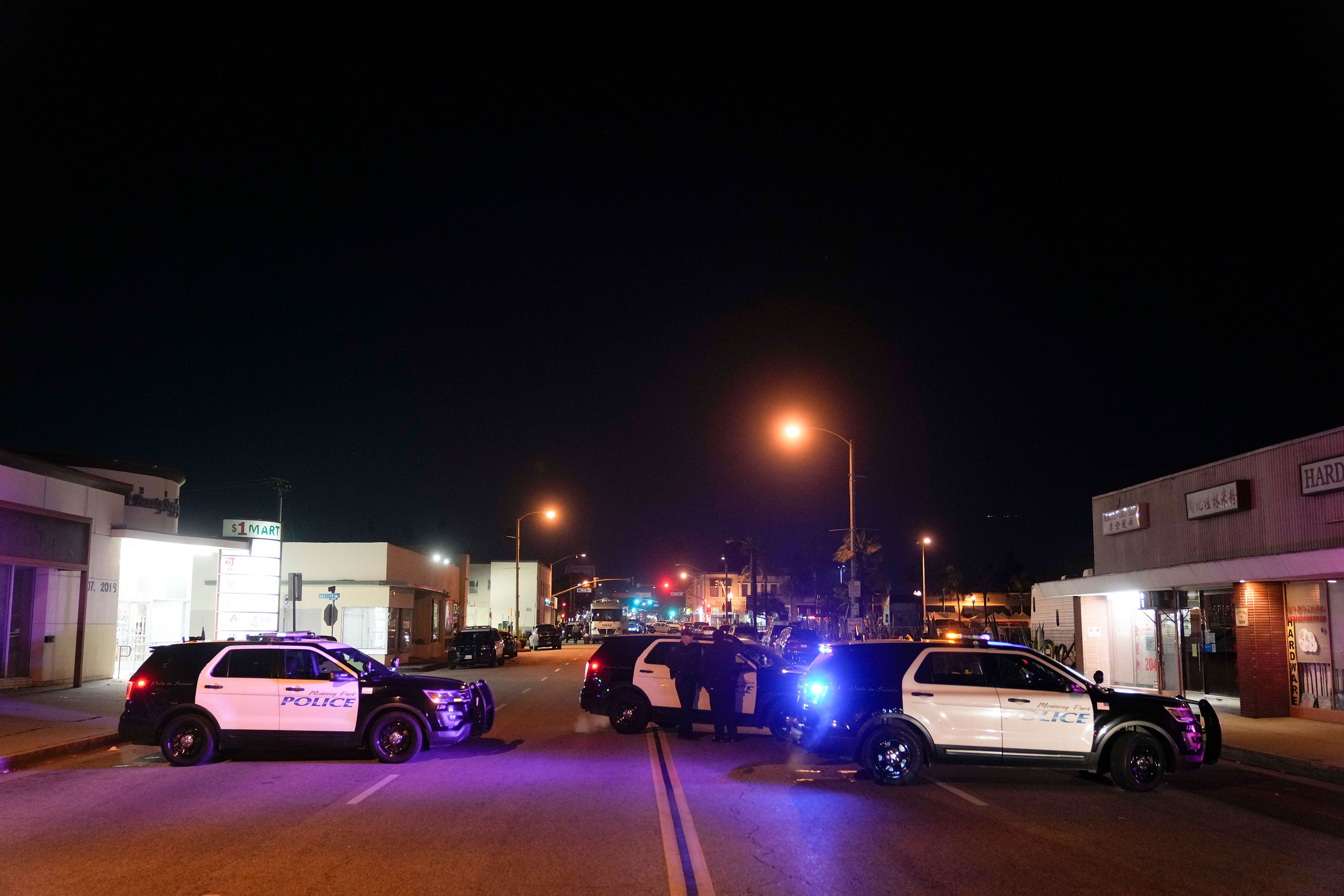 Police vehicles block the street near a scene where a shooting took place in Monterey Park, California on Sunday. 