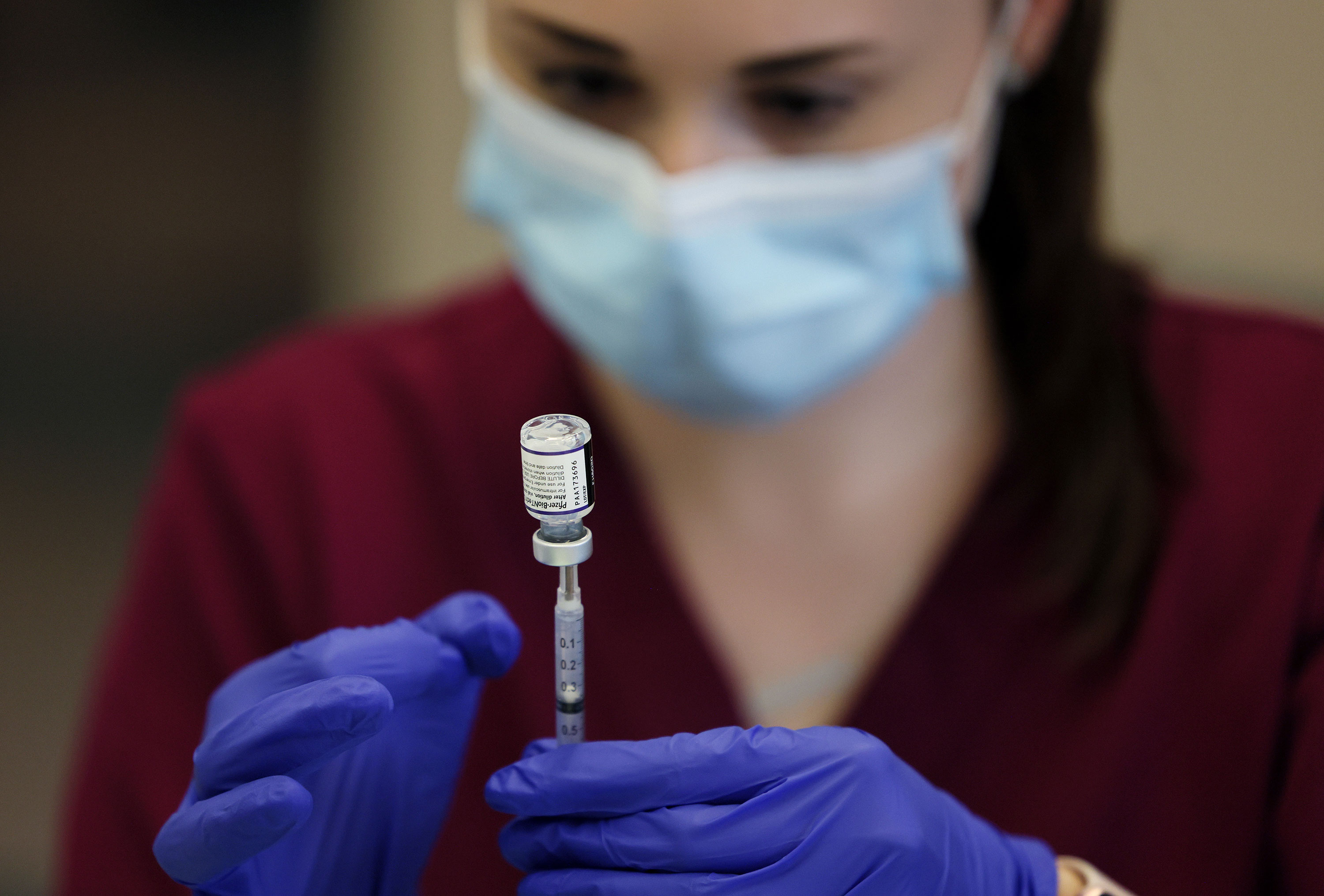 A registered nurse draws up a dose of the Pfizer Covid-19 vaccine in Arlington, Massachusetts, on November 9.