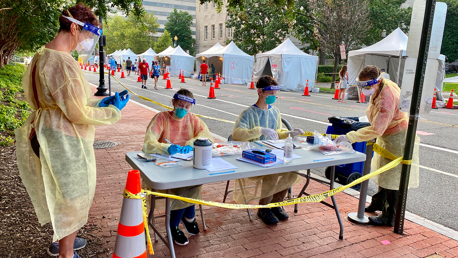 Health workers provide Covid-19 testing on a street in Washington, DC, on August 14.