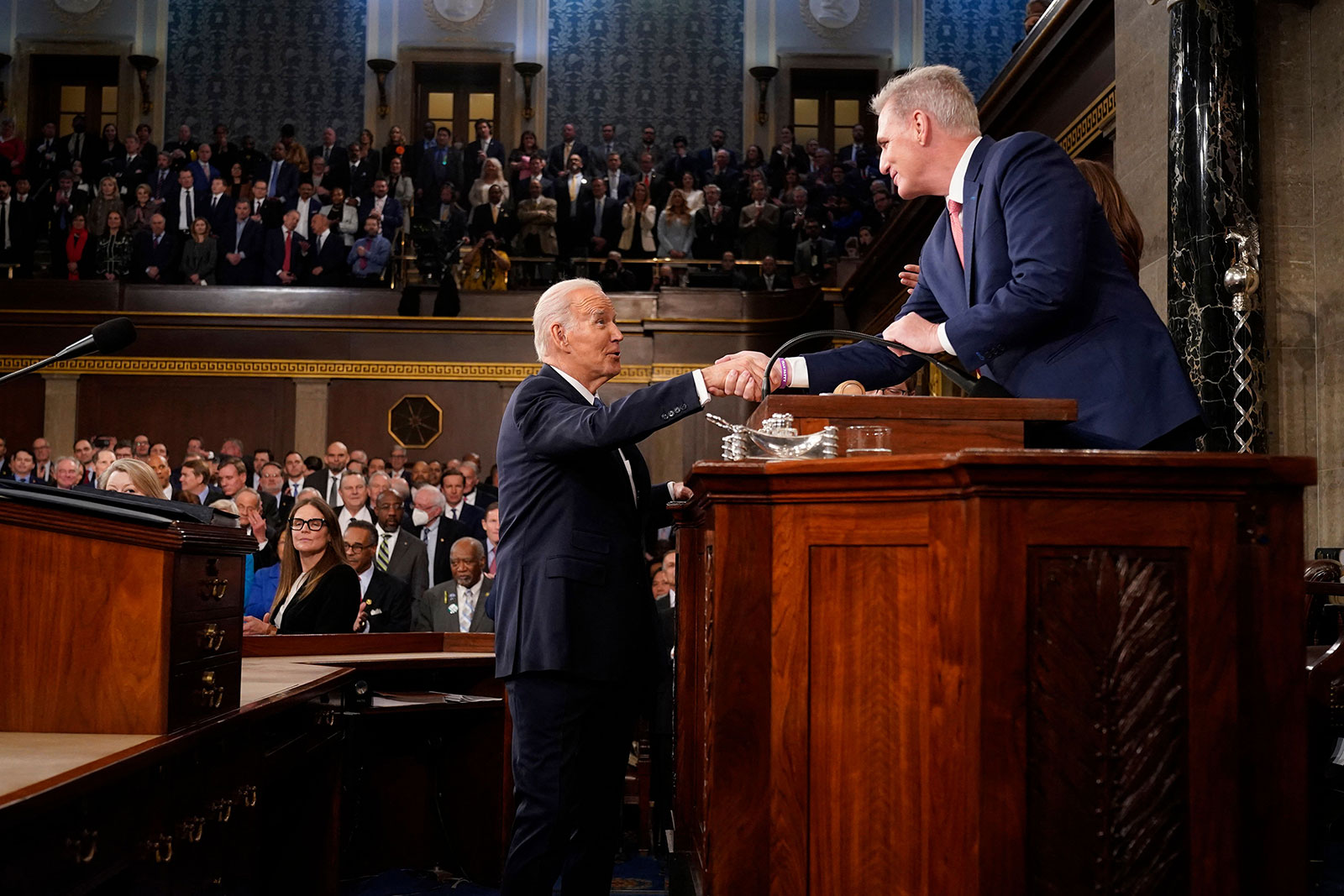 Biden shakes hands with House Speaker Kevin McCarthy.
