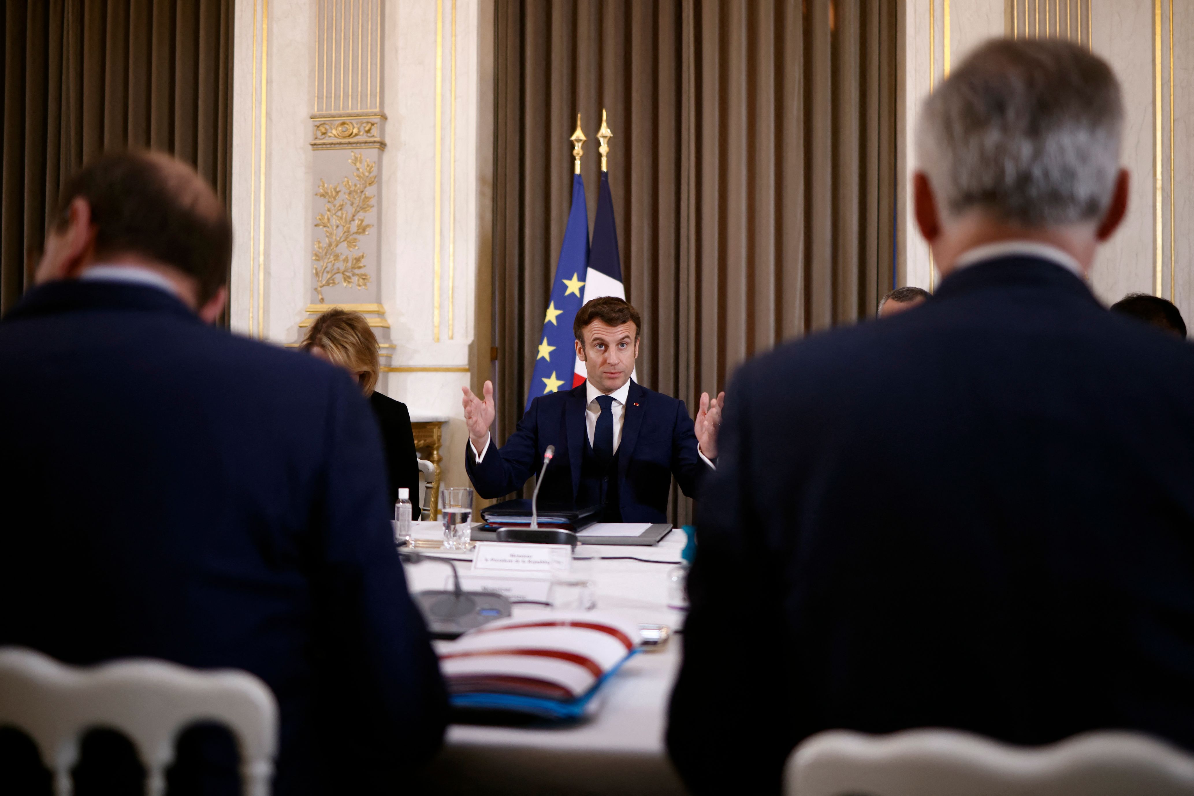 French President Emmanuel Macron (C) chairs a Defense Council regarding Russia's attack to Ukraine, at the Elysee Palace in Paris, France, on February 28.