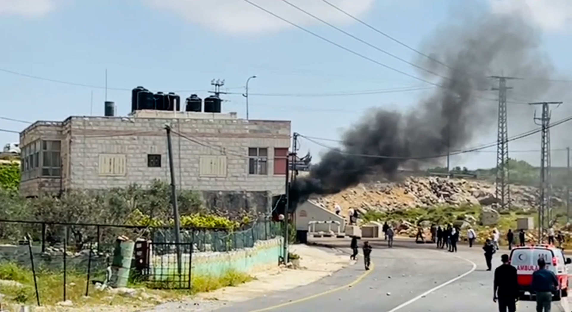A screen grab from video obtained by CNN shows clashes between Israeli settlers and Palestinians in the village of Beitin in the West Bank on April 13.