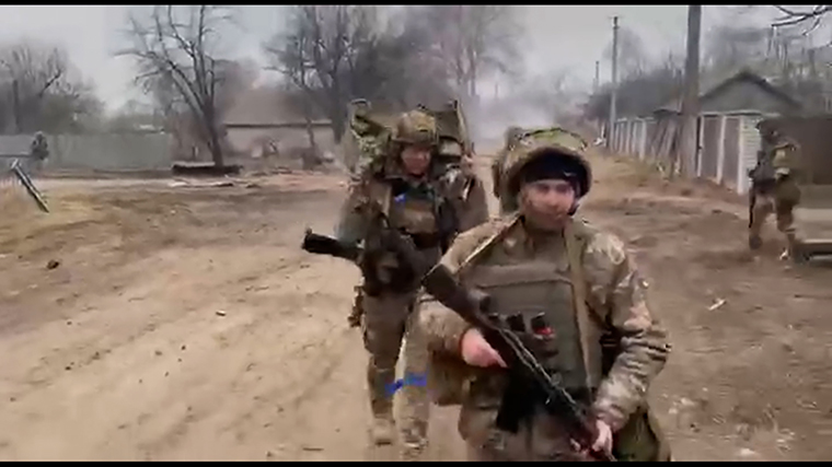 Ukrainian forces are seen in the village of Sloboda.
