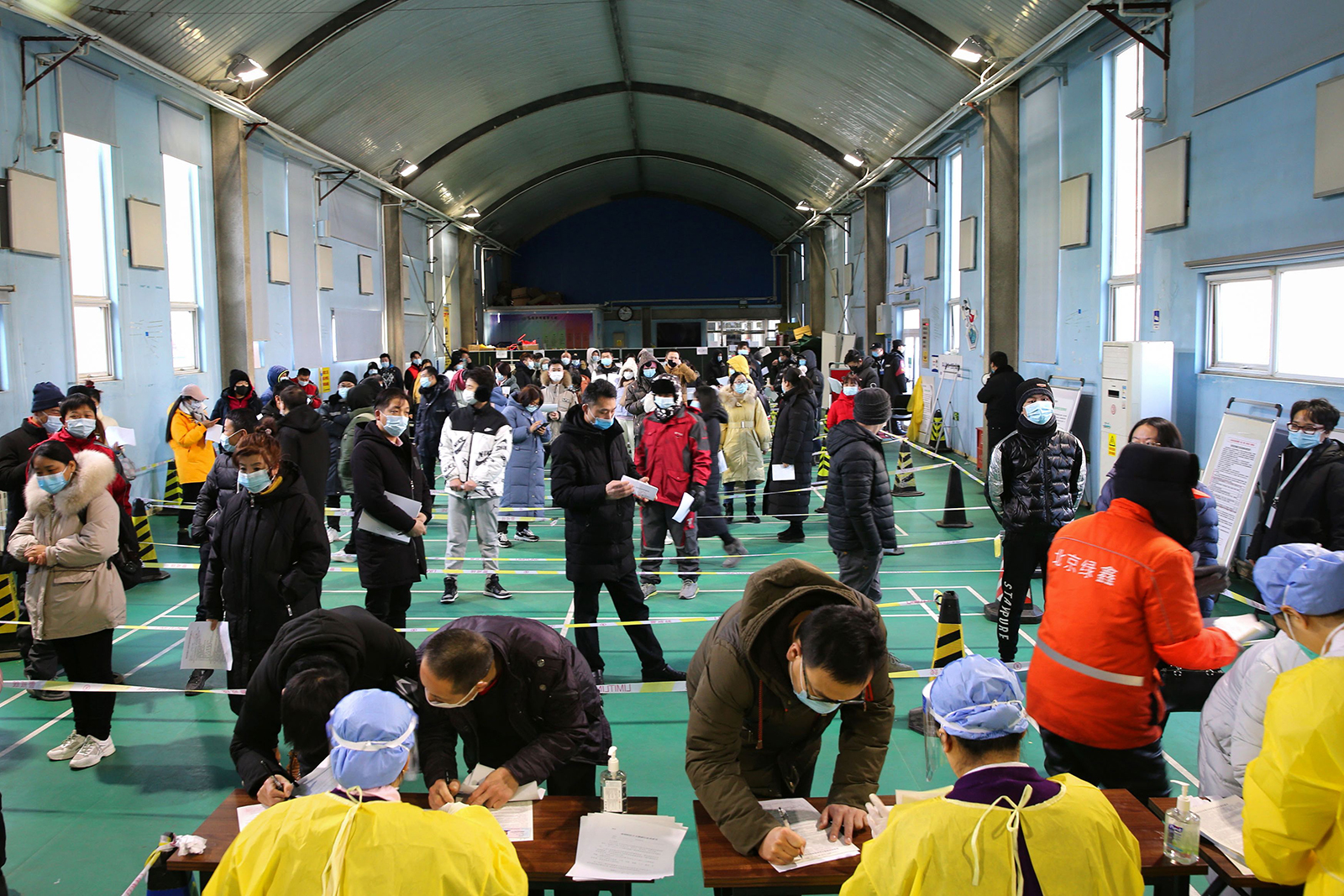 People queue to receive a Covid-19 vaccine at a temporary vaccination center in Beijing, on January 8.
