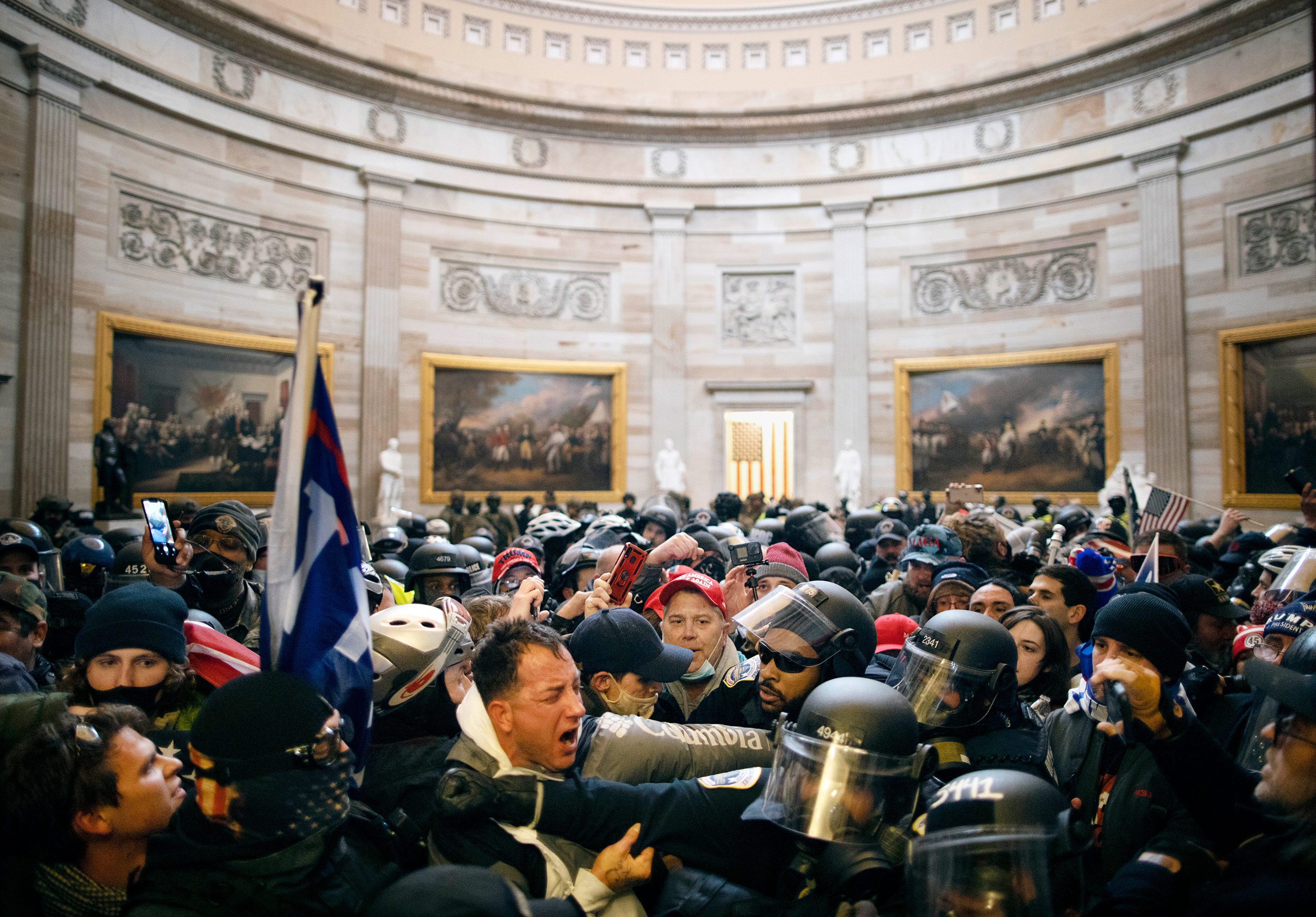 Police clash with rioters who breached security and entered the Capitol building in Washington DC, on January 6. 