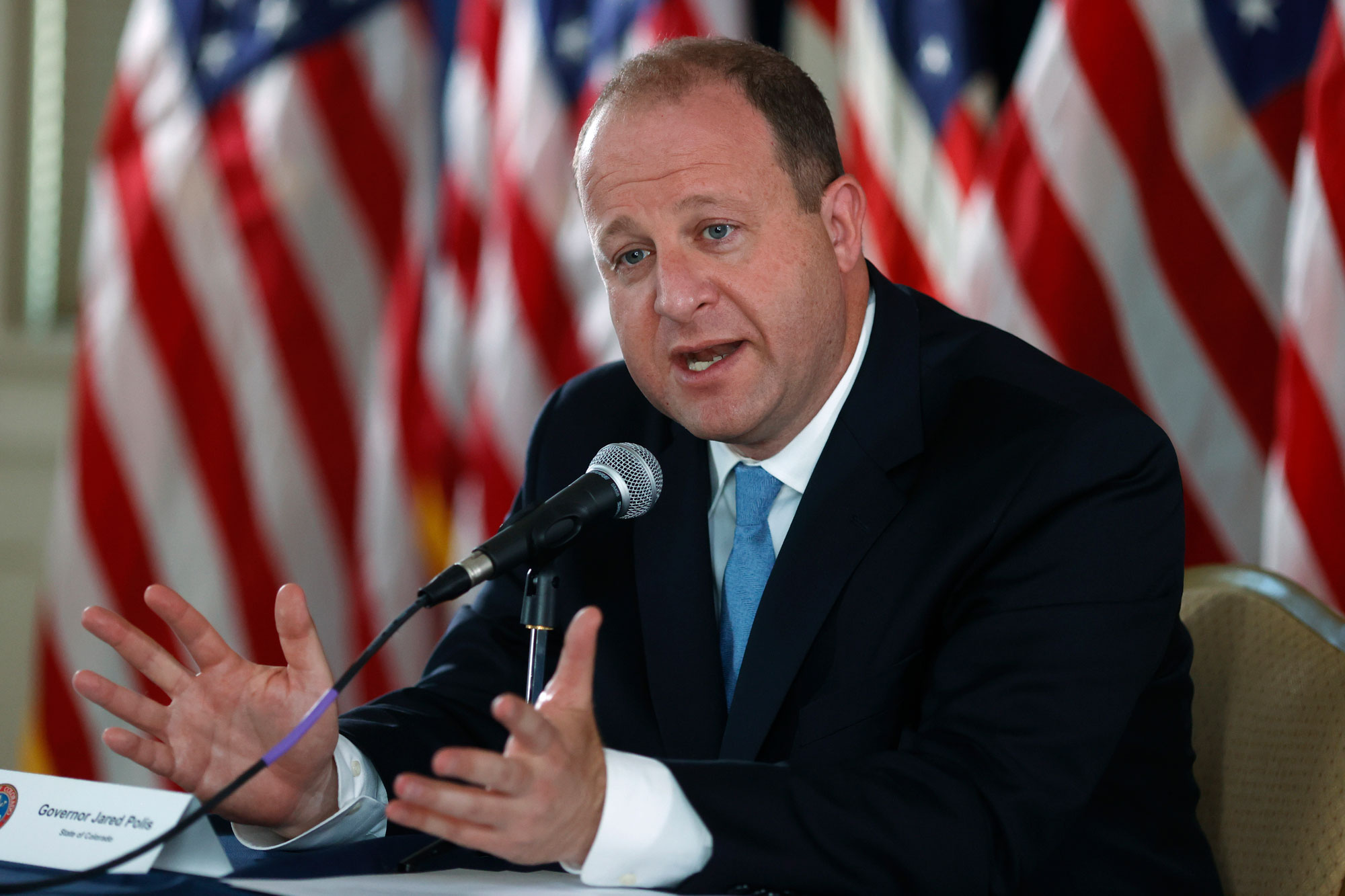 Colorado Governor Jared Polis makes a point during a news conference to update the state's efforts to stop the rise of the new coronavirus on Wednesday, May 20, in Denver. 