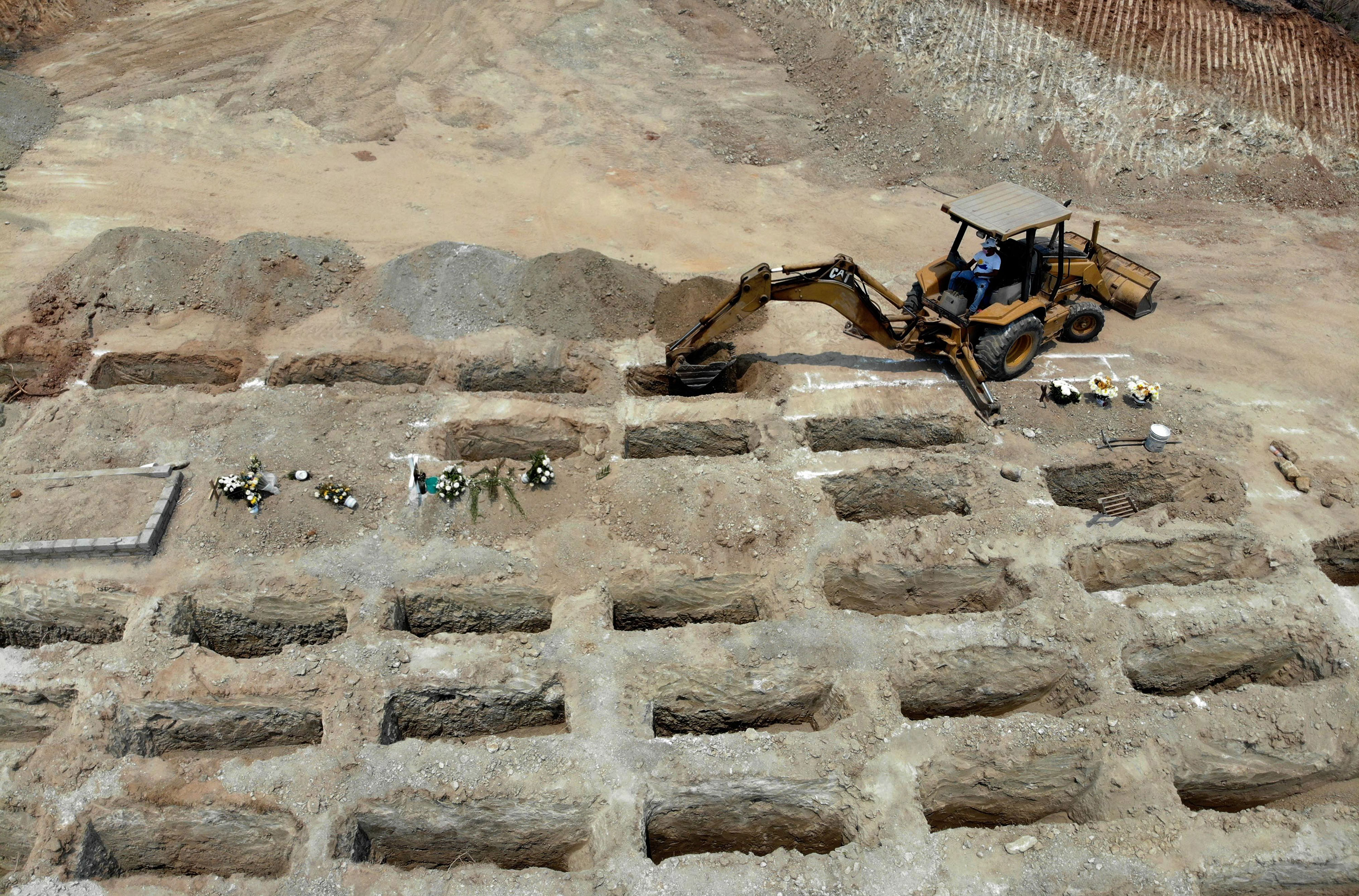 Workers dig 300 graves at the El Palmar Phanteon for coronavirus victims in Acapulco, Mexico on May 22.