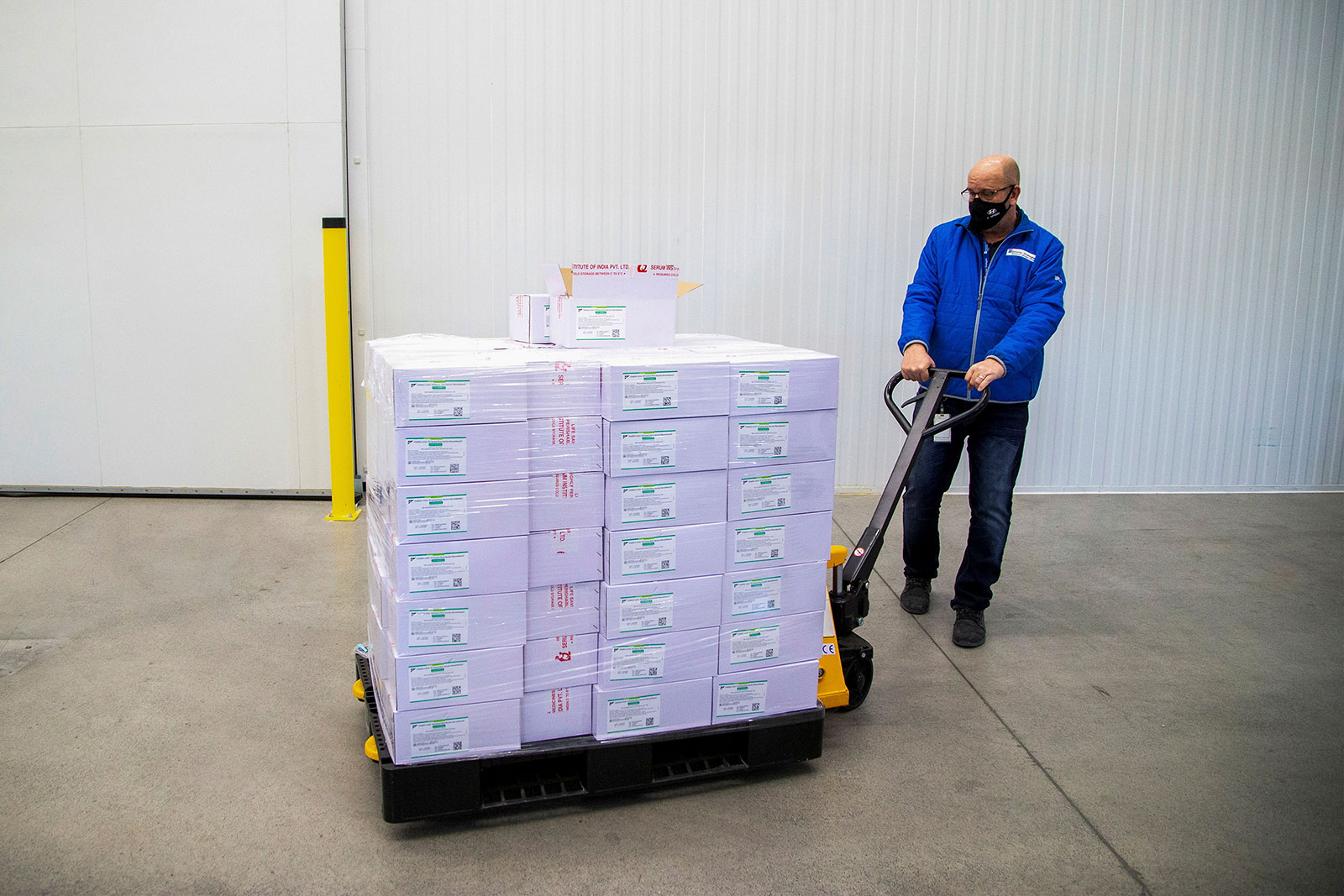 Michael Gray moves a pallet of AstraZeneca Covid-19 vaccine doses in Ontario, Canada, on March 3.