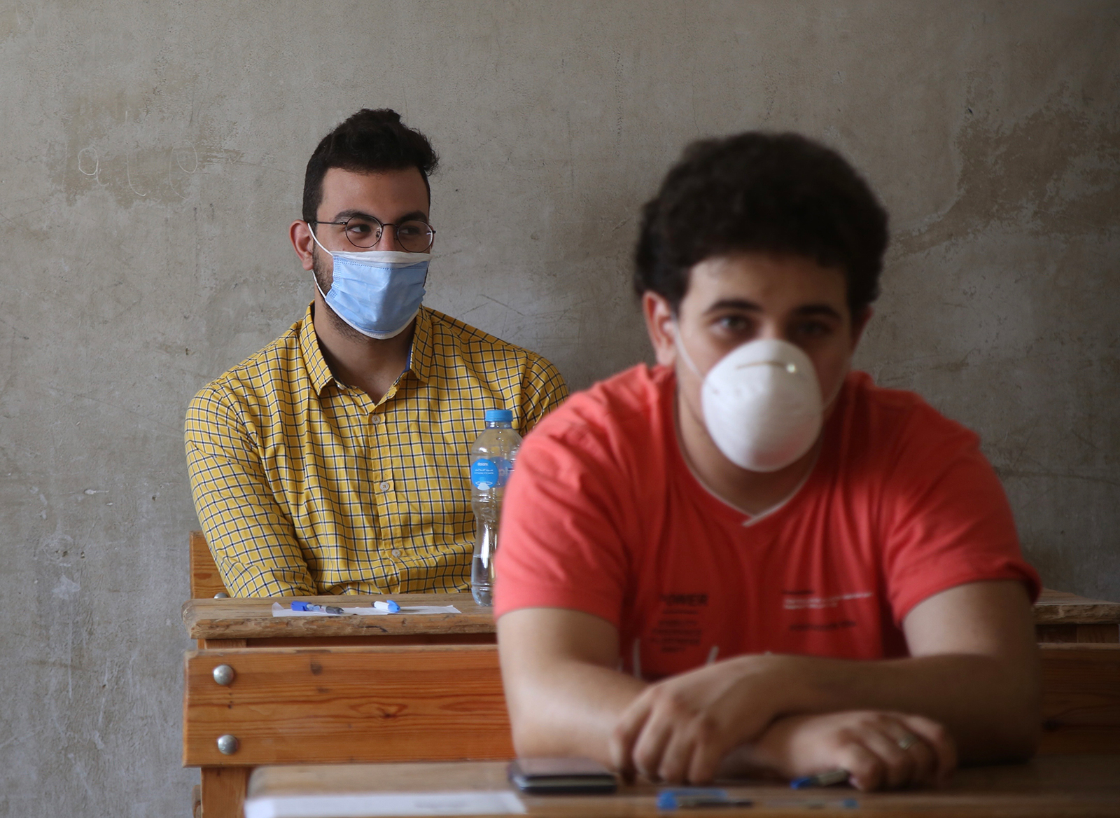 Students wearing face masks are seen at a high school exams site in Cairo, Egypt, on June 21.