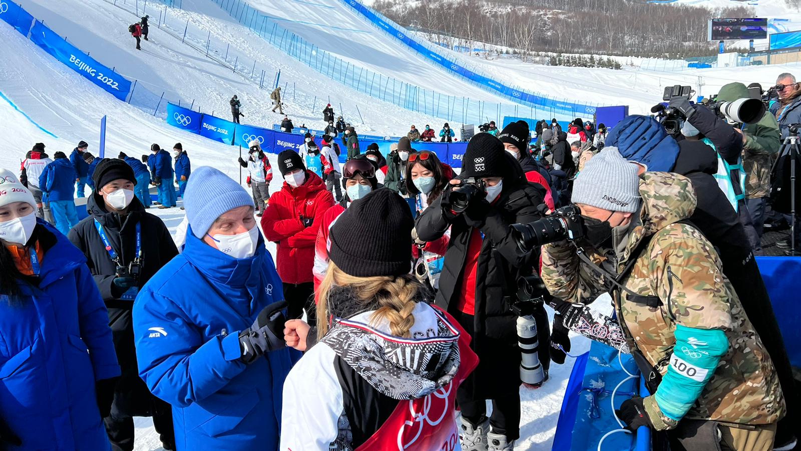 American snowboarder Chloe Kim fist bumps Thomas Bach on Thursday after winning gold.