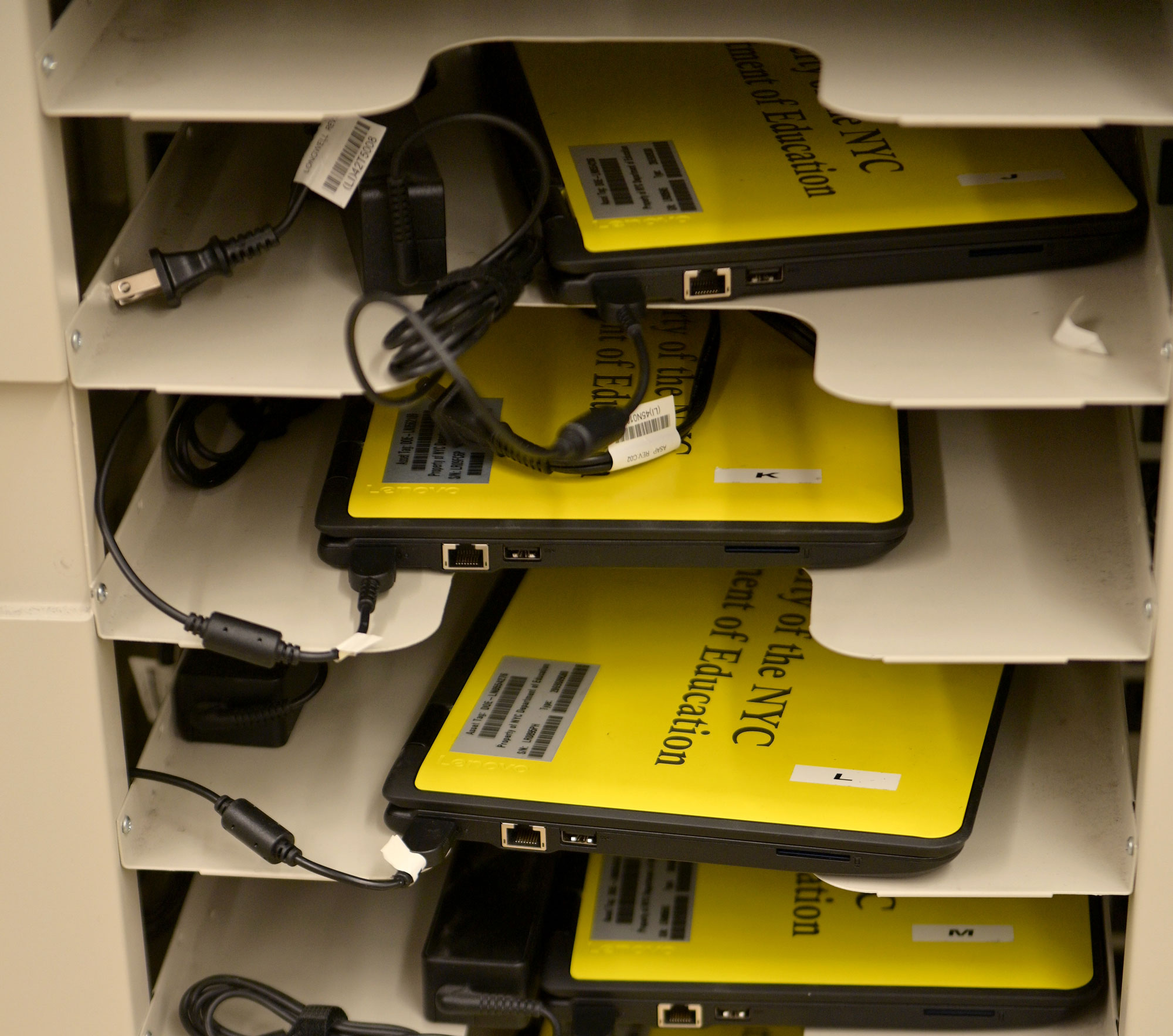 A cart is used to hold and organize school-owned laptops to be distributed to students in need for remote learning at Yung Wing School P.S. 124 in the Manhattan borough of New York City on March 19. 