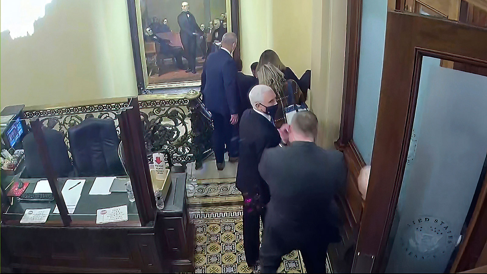 Then-Vice President Mike Pence is evacuated down the stairs of the US Capitol on January 6, 2021.