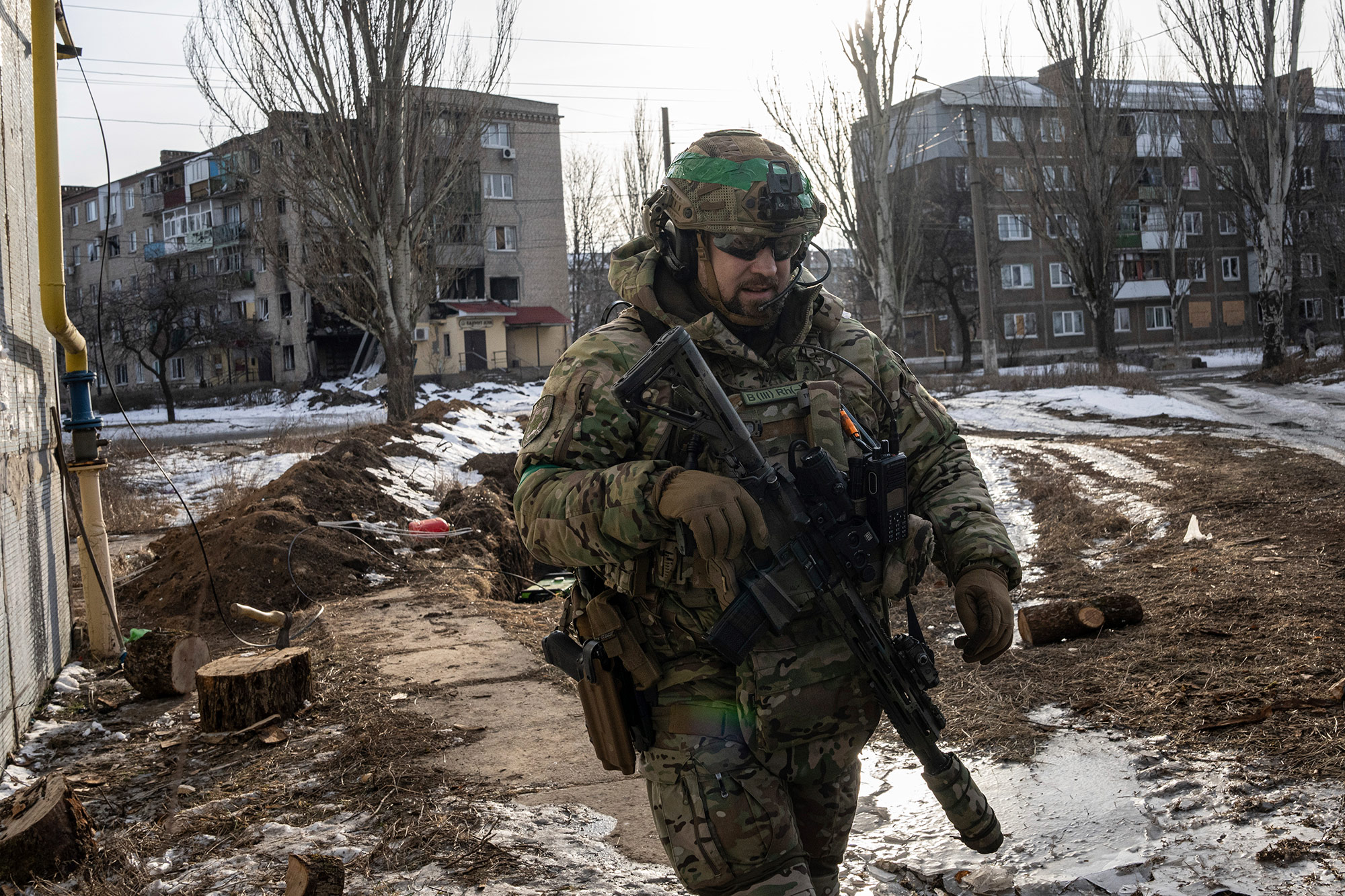 A Ukrainian soldier patrols a street in Bakhmut, Friday, February 24. 