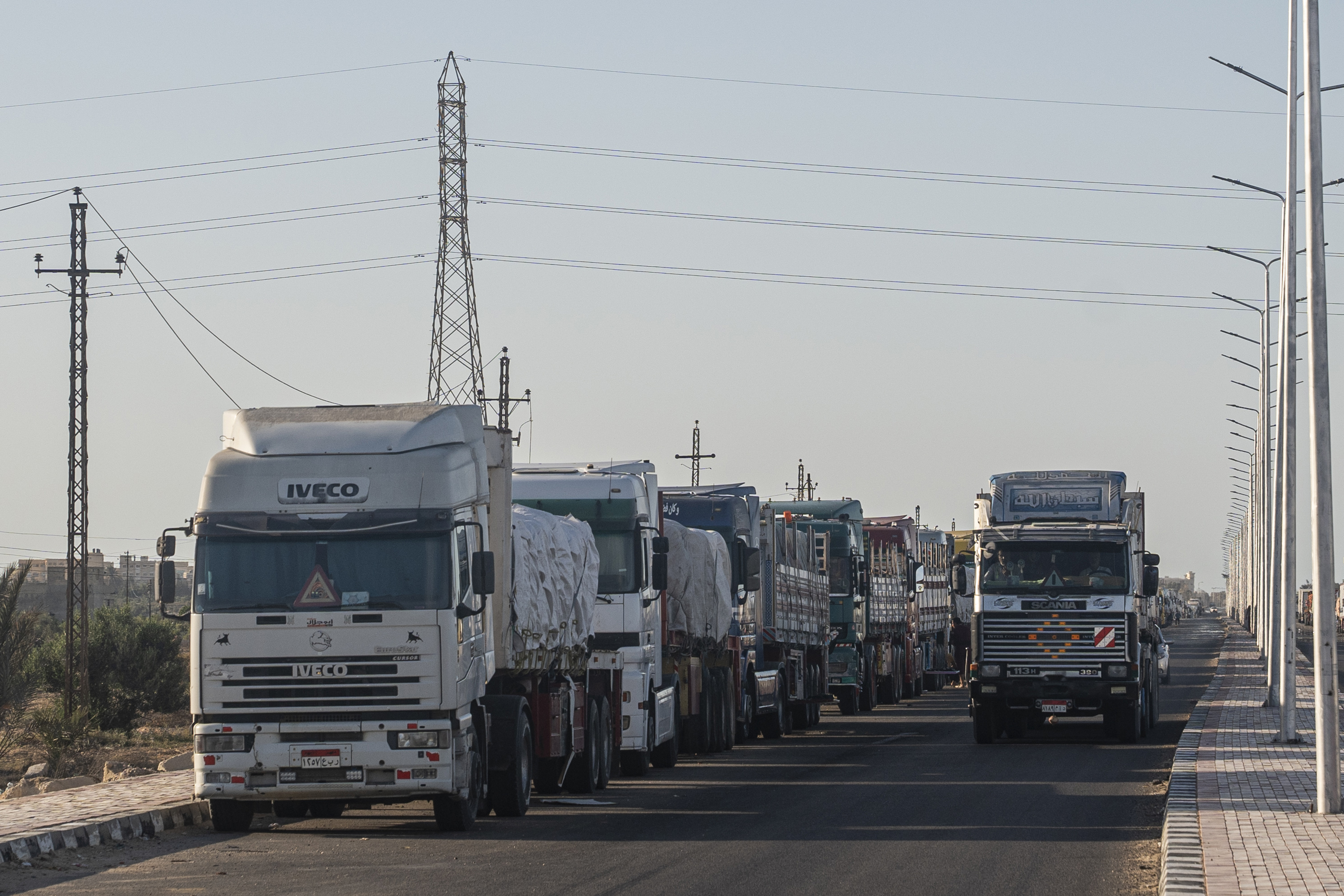 Aid trucks loaded with supplies for Gaza wait in Al-Arish City, Egypt, after the border closed on May 8.