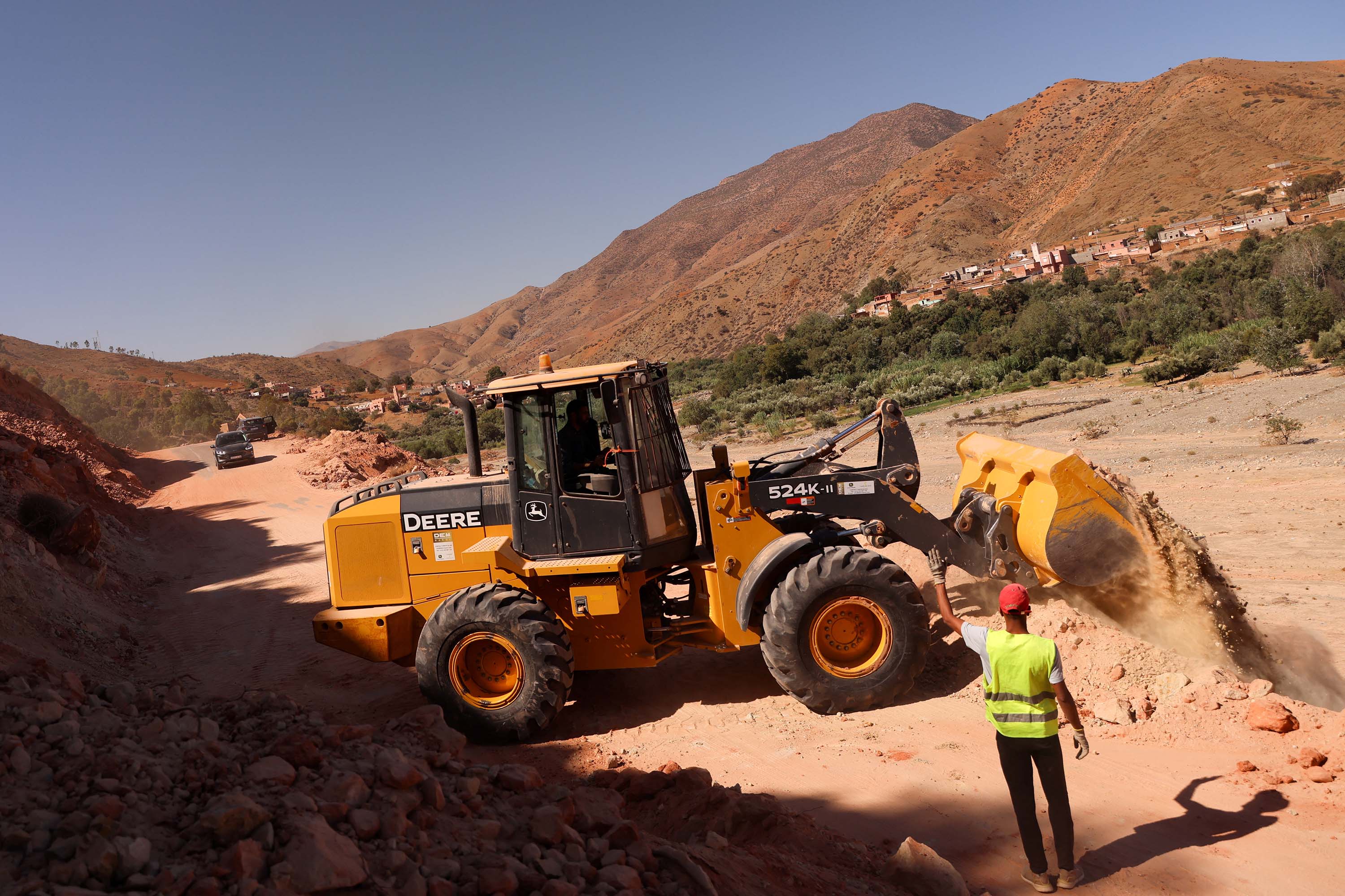 Machinery is used to remove debris from a road outside Adassil, Morocco, on Monday, September 11.