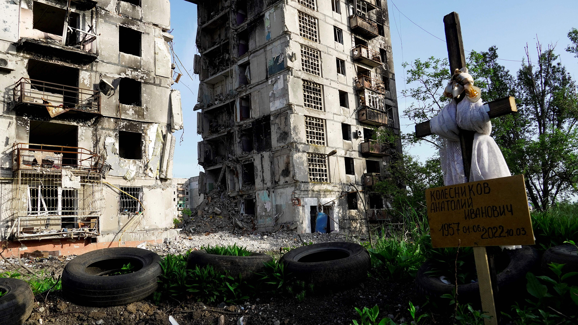 A grave is pictured in front of destroyed residential buildings in Mariupol, Ukraine, on May 31.