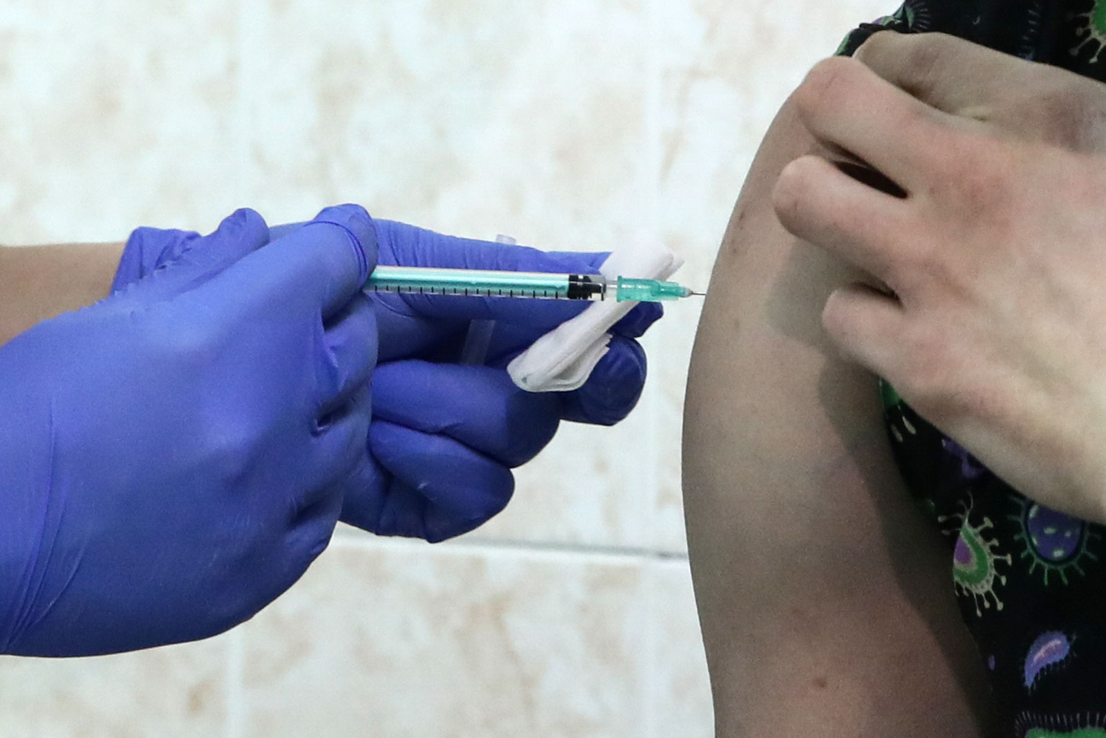 A person in Novosibirsk, Russia, gets the Sputnik V coronavirus vaccine on December 9.
