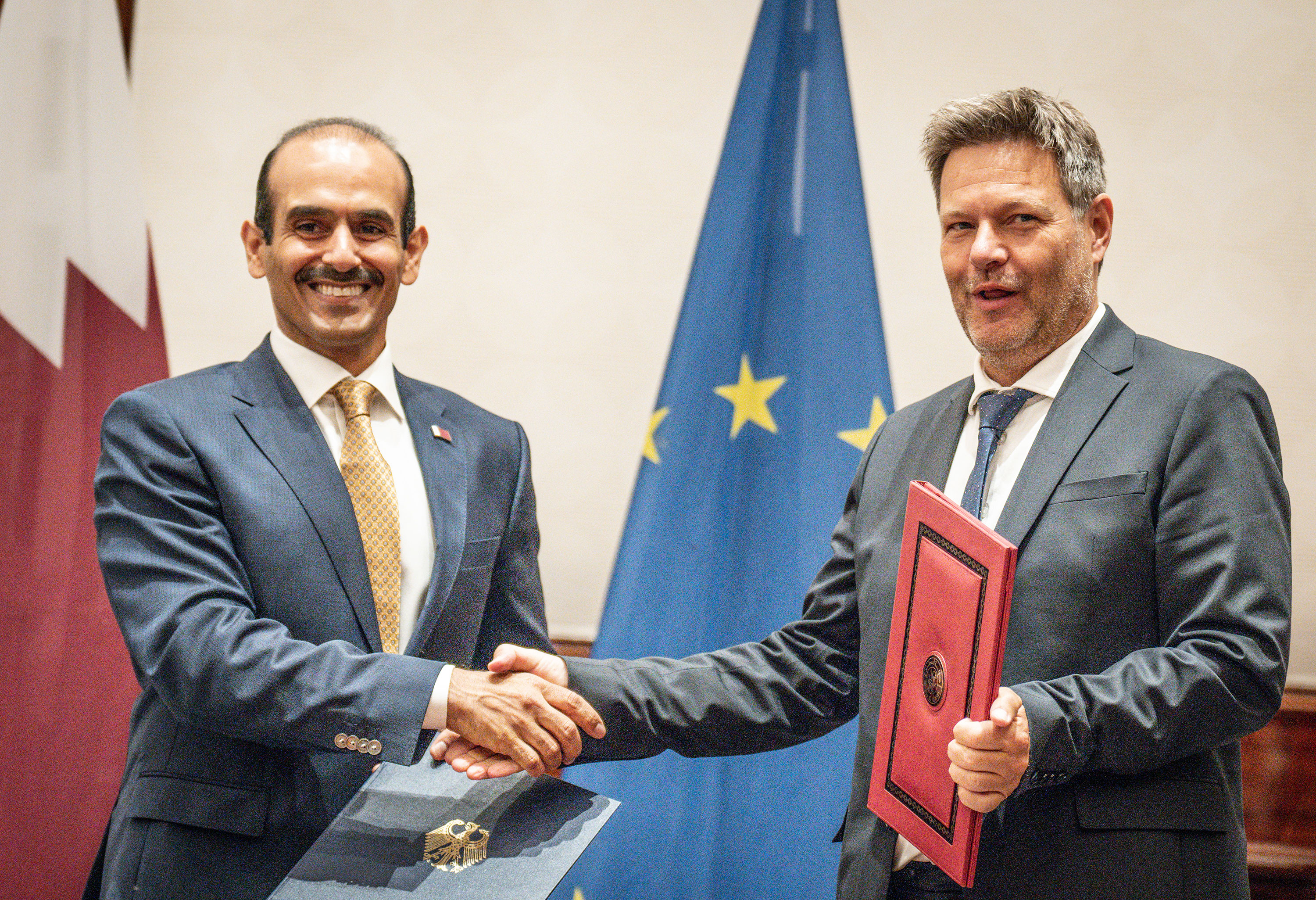 Qatari Minister of State for Energy Saad Sherida Al-Kaabi shakes hands with German Federal Minister for Economic Affairs and Climate Protection Robert Habeck after they signed a new energy partnership between their countries on Friday.
