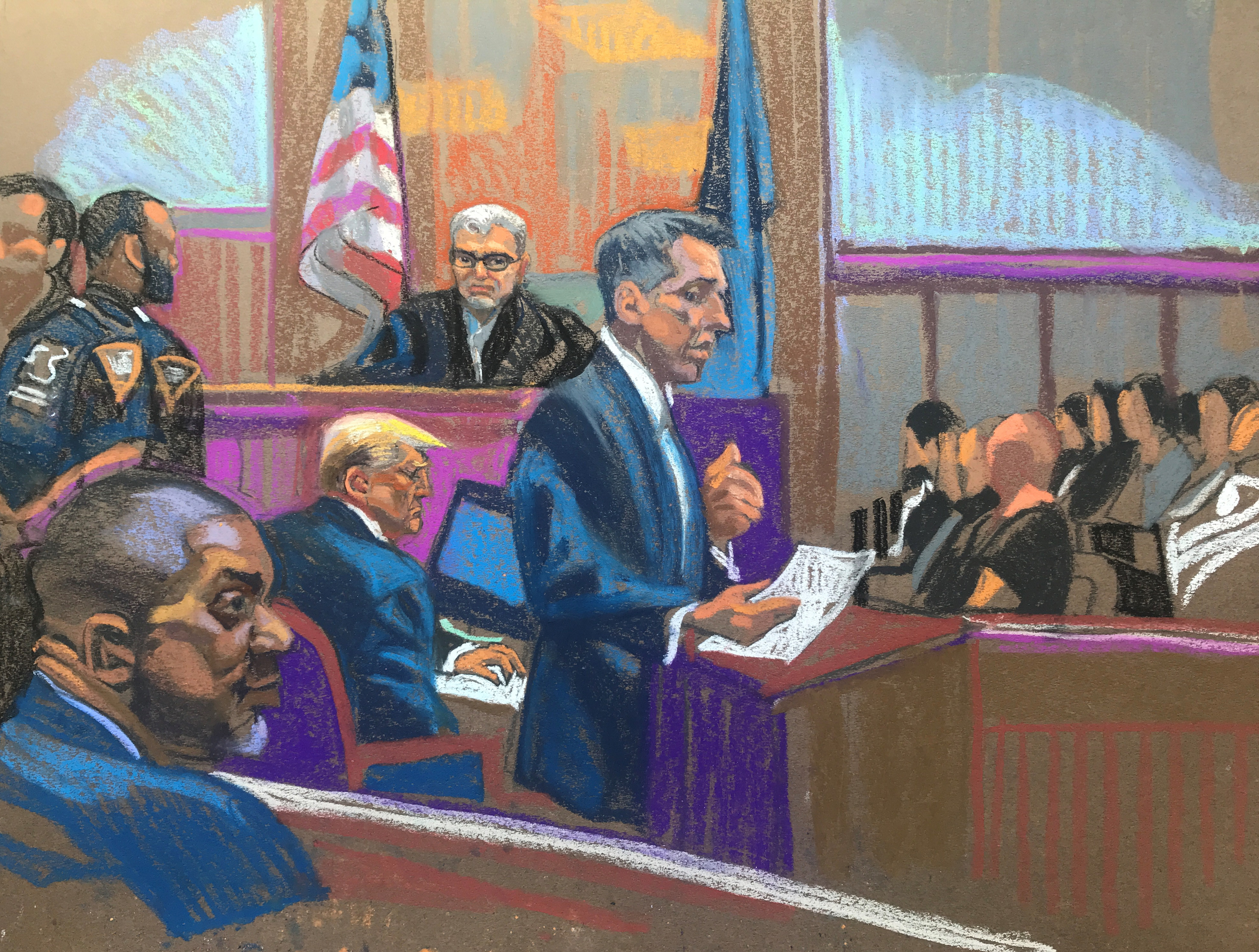 Prosecutor Matthew Colangelo speaks at the lectern Monday morning in opening statements in Day 5 of former President Donald Trump's criminal hush money trial taking place in Manhattan, New York, on April 22.