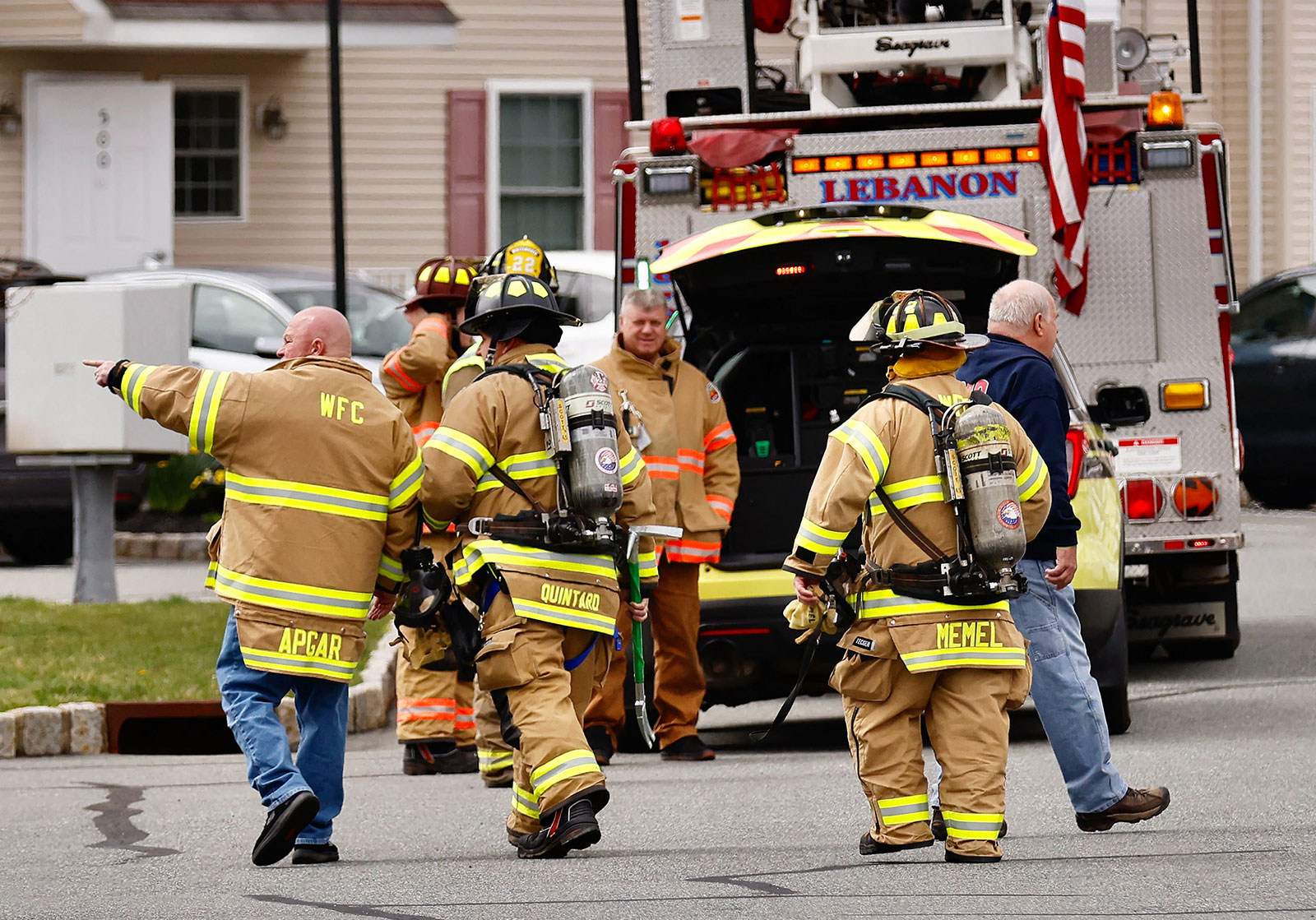 First responders arrive to inspect homes in Lebanon, New Jersey, on Friday.