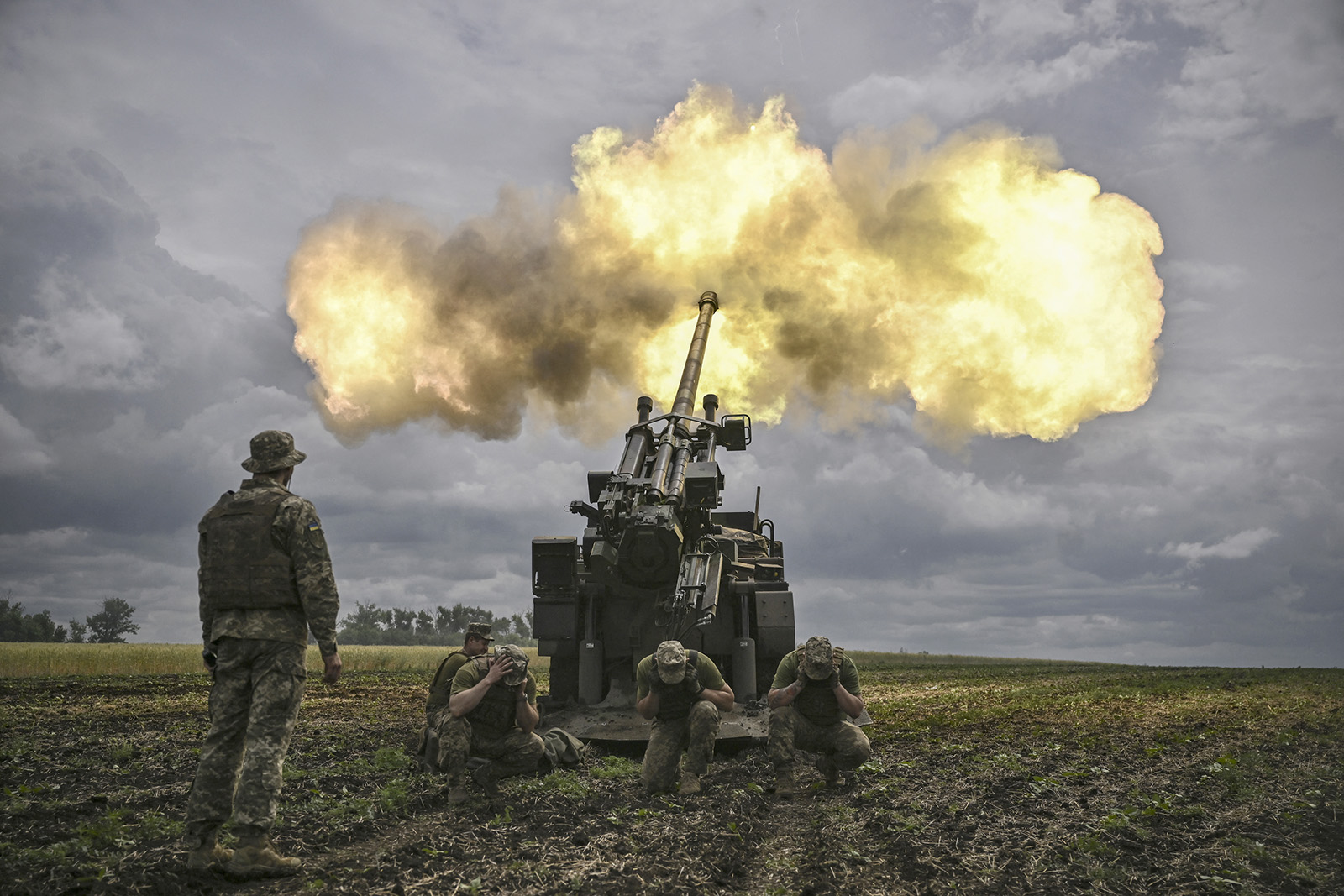 Ukrainian servicemen fire a French self-propelled 155 mm/52-calibre Caesar gun towards Russian positions near the front line in the eastern Ukrainian region of Donbas on June 15.