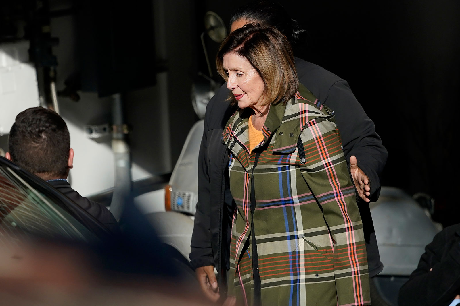 House Speaker Nancy Pelosi is escorted to a conveyance  extracurricular  of her location  successful  San Francisco connected  November 2. 