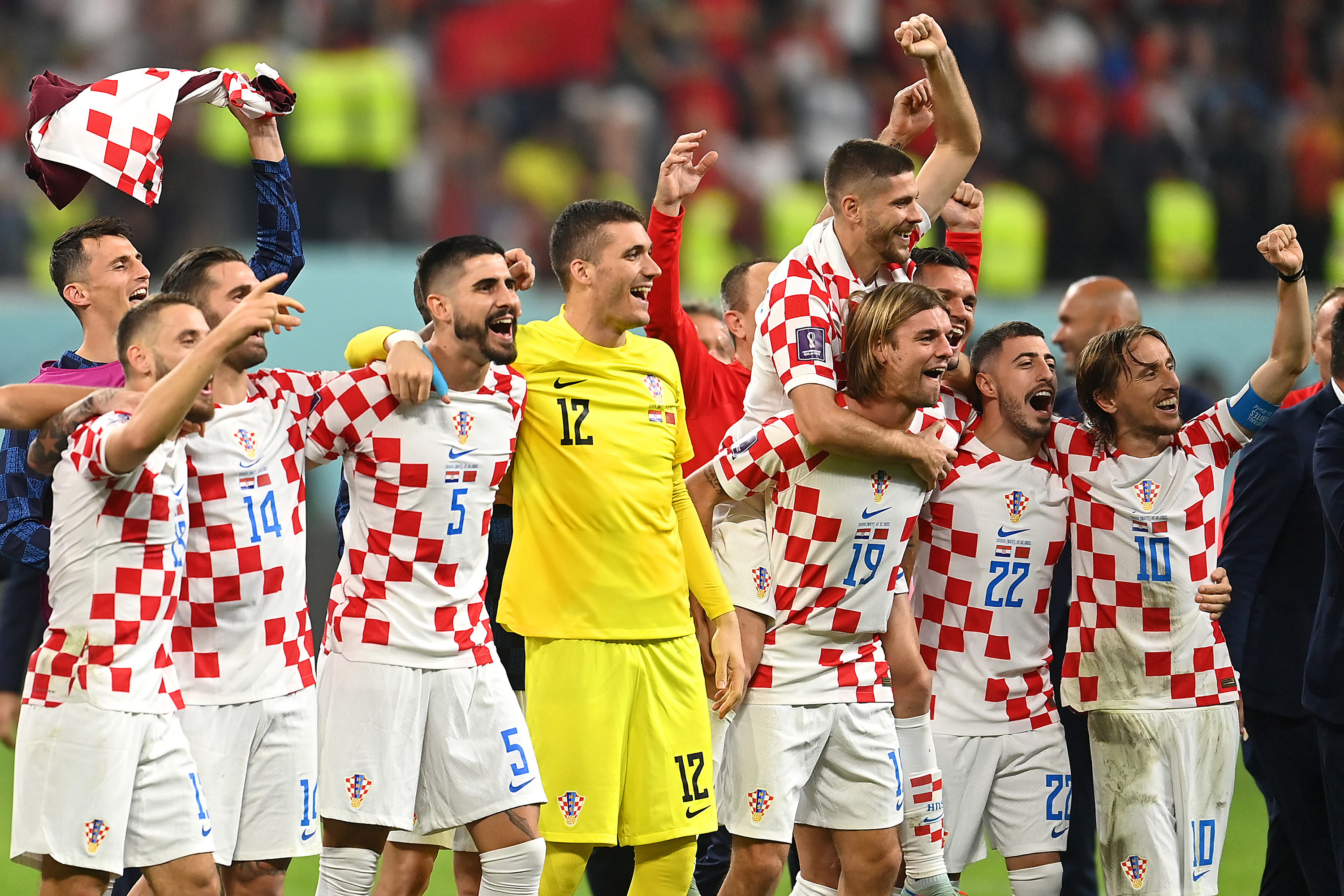 Croatia players celebrate their 2-1 win over Morocco on Saturday. 