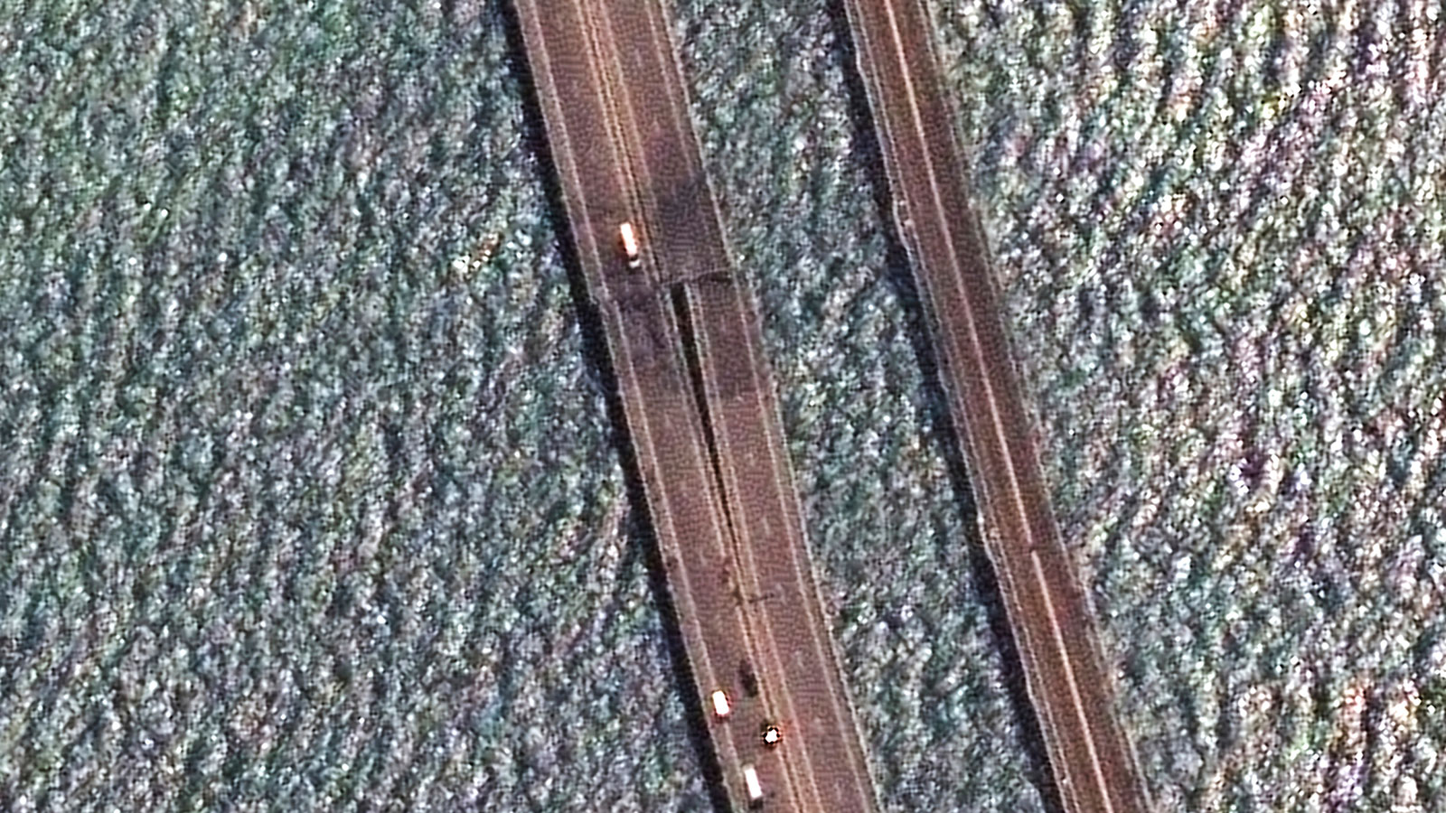 A satellite image provided by Maxar Technologies shows damaged parts of the bridge connecting the Russian mainland and the Crimean peninsula over the Kerch Strait on Monday, July 17.